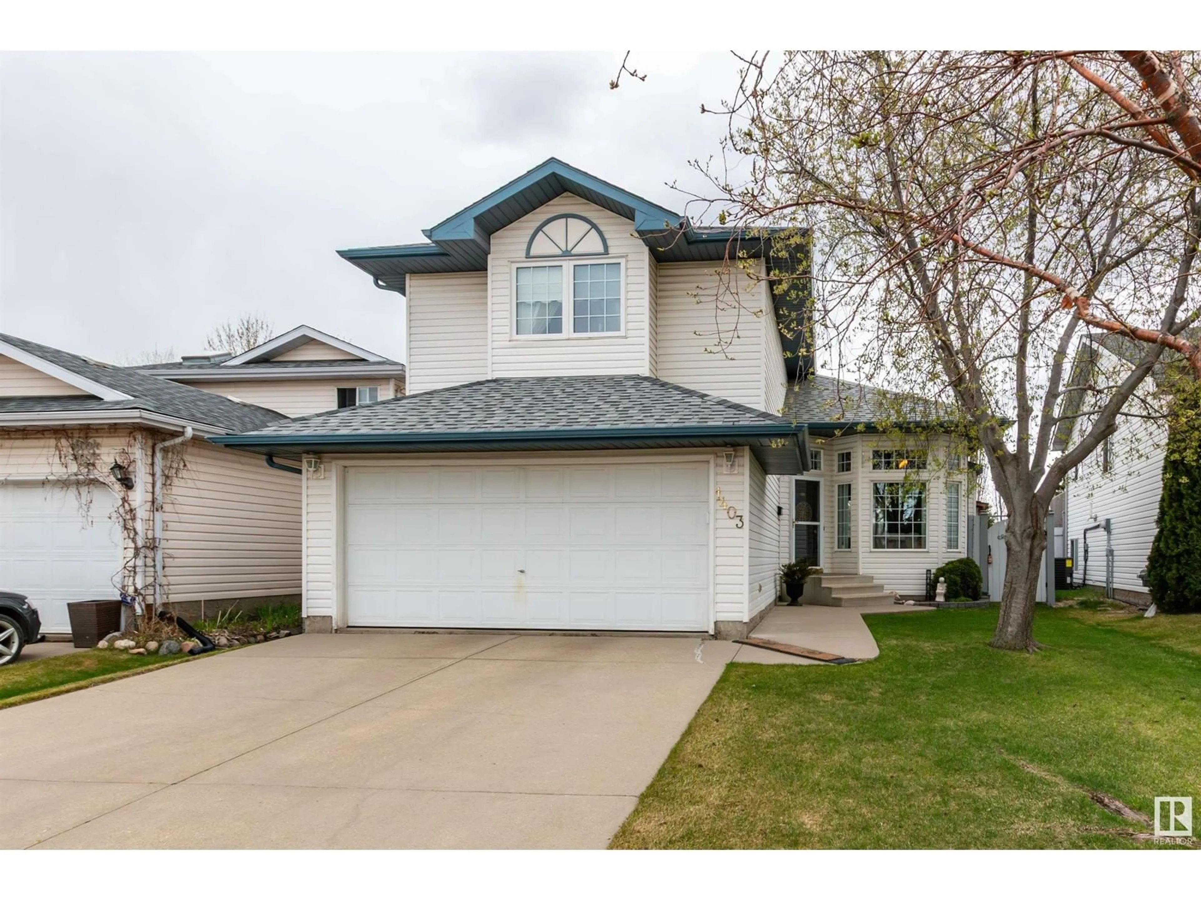 Home with vinyl exterior material, street for 1403 JEFFERYS CR, Edmonton Alberta T6L6T4
