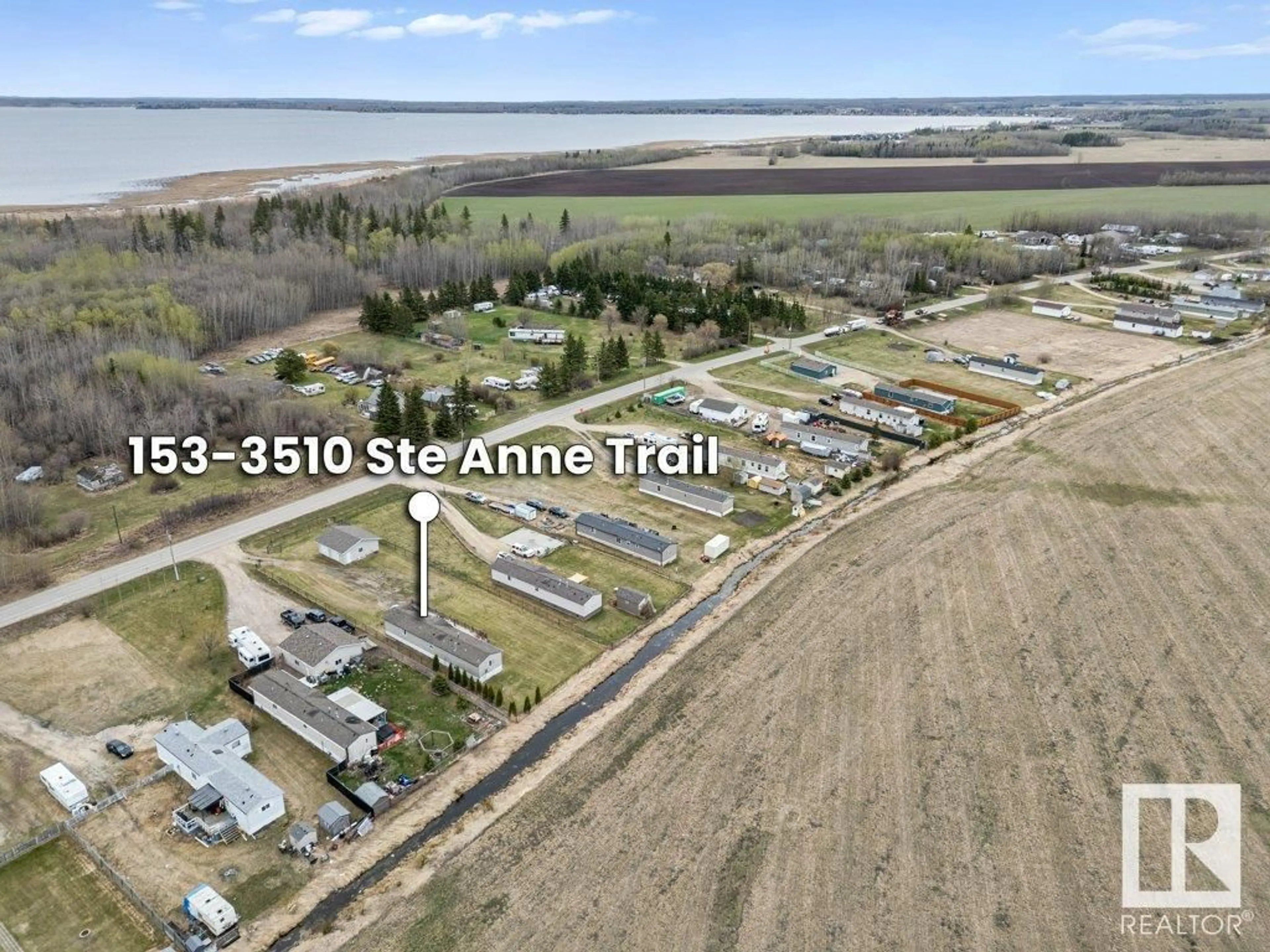 A pic from outside/outdoor area/front of a property/back of a property/a pic from drone, street for 3510 - 153 STE. ANNE TR, Rural Lac Ste. Anne County Alberta T0E1A0
