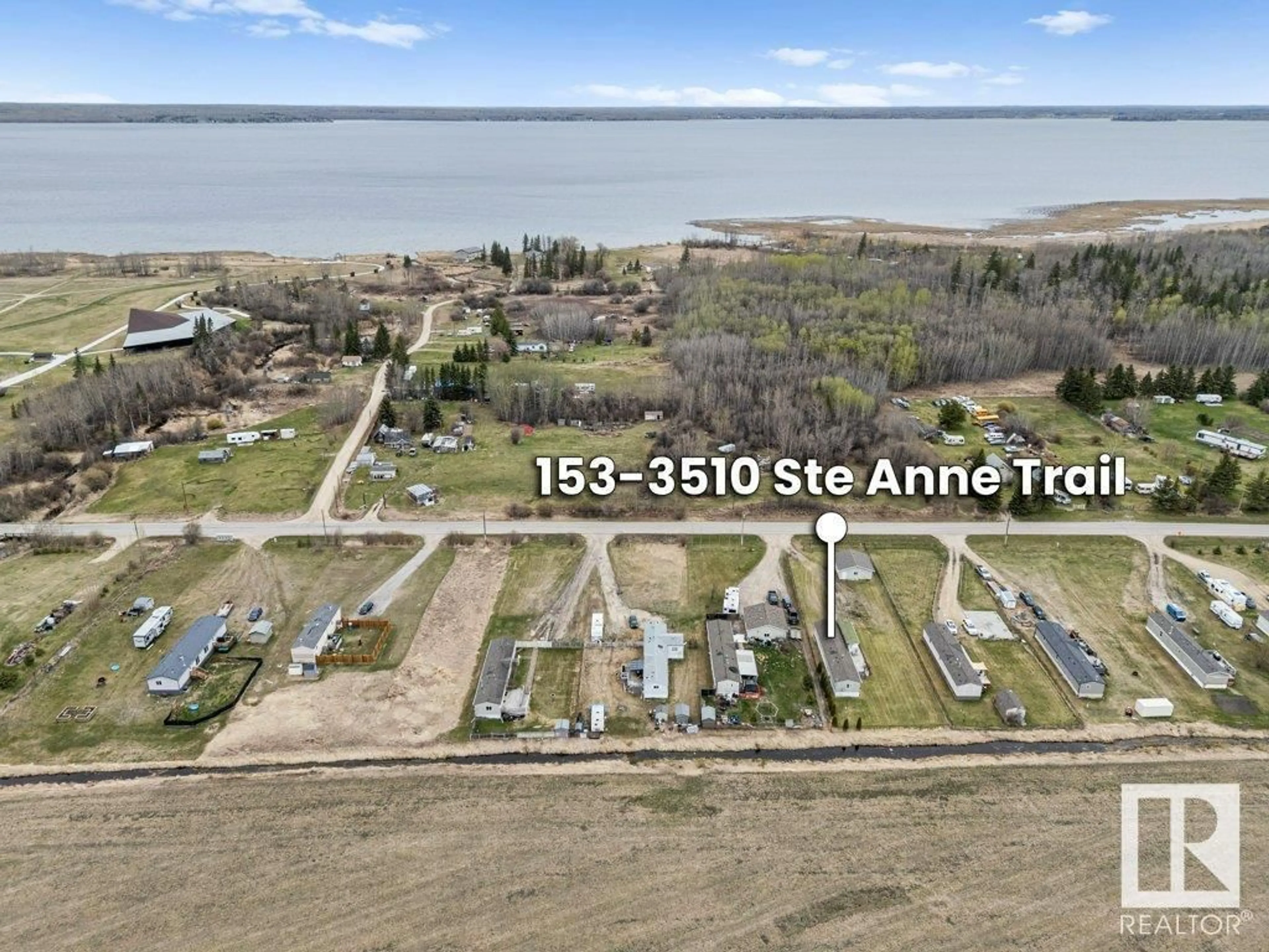 A pic from outside/outdoor area/front of a property/back of a property/a pic from drone, water/lake/river/ocean view for 3510 - 153 STE. ANNE TR, Rural Lac Ste. Anne County Alberta T0E1A0