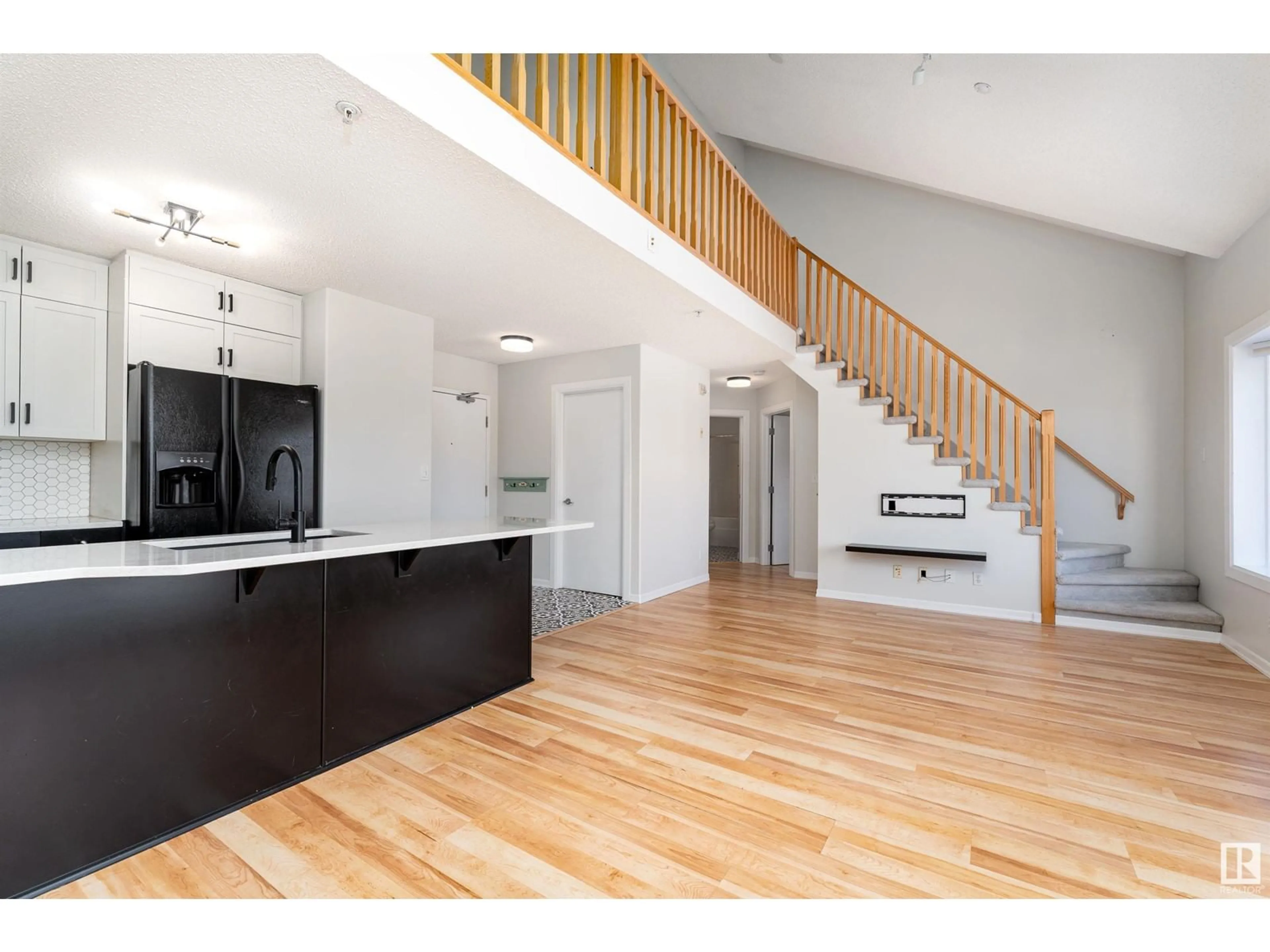 Open concept kitchen, wood/laminate floor for 305 - 8536 106A ST NW, Edmonton Alberta T6E4J9