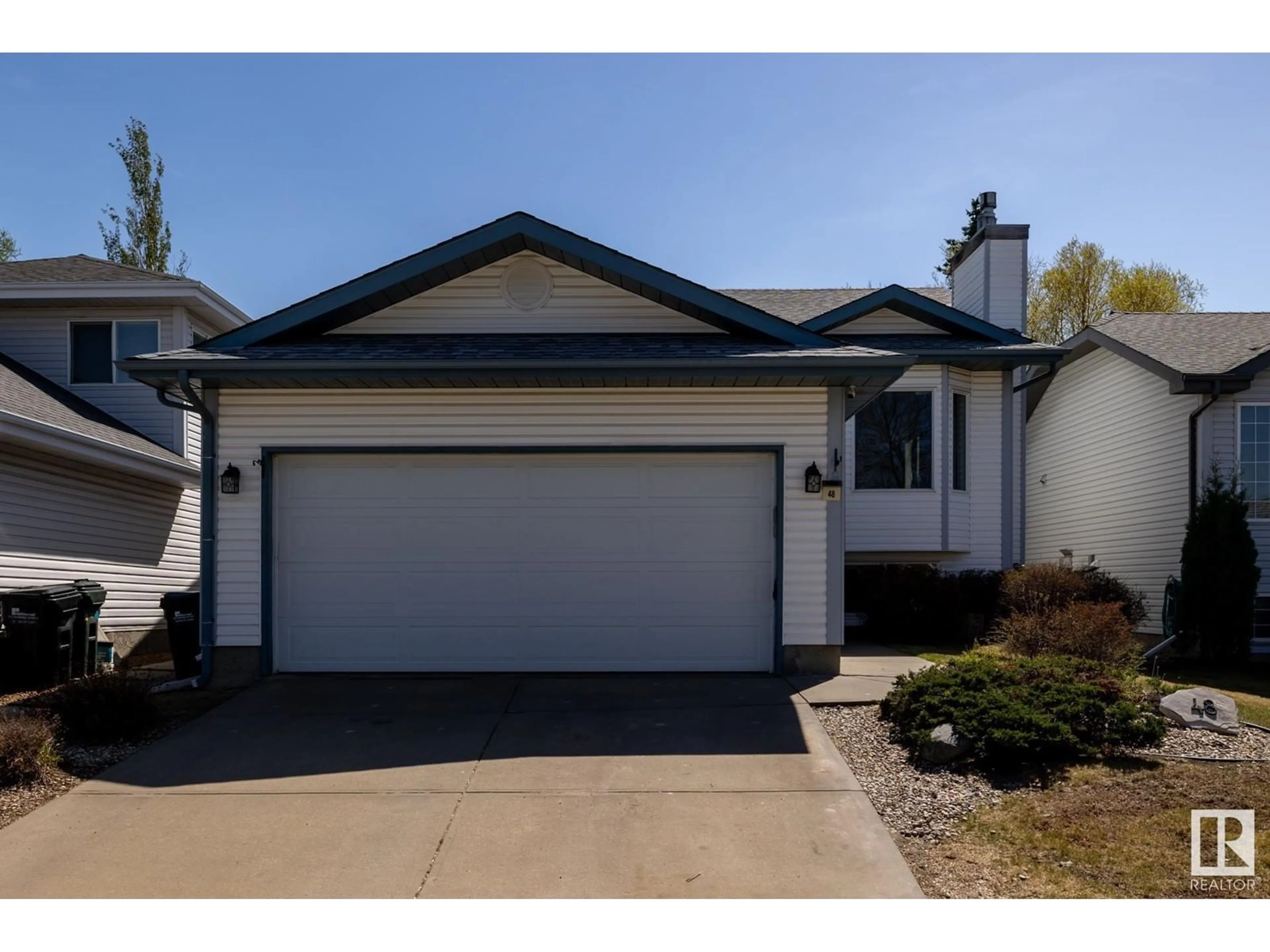 Home with vinyl exterior material, street for 48 BLUEBERRY CR, Sherwood Park Alberta T8H1P6