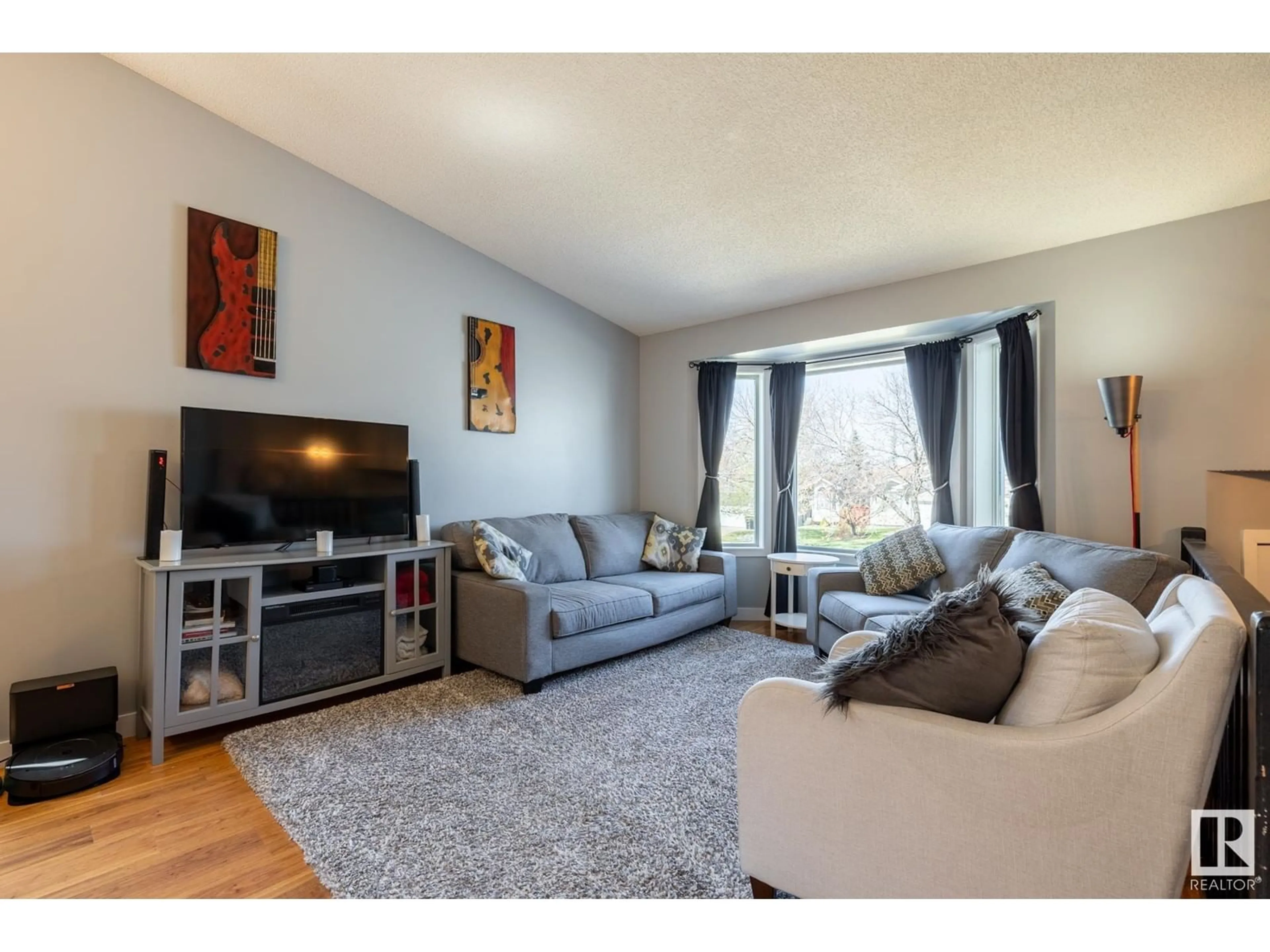 Living room with furniture, wood/laminate floor for 48 BLUEBERRY CR, Sherwood Park Alberta T8H1P6