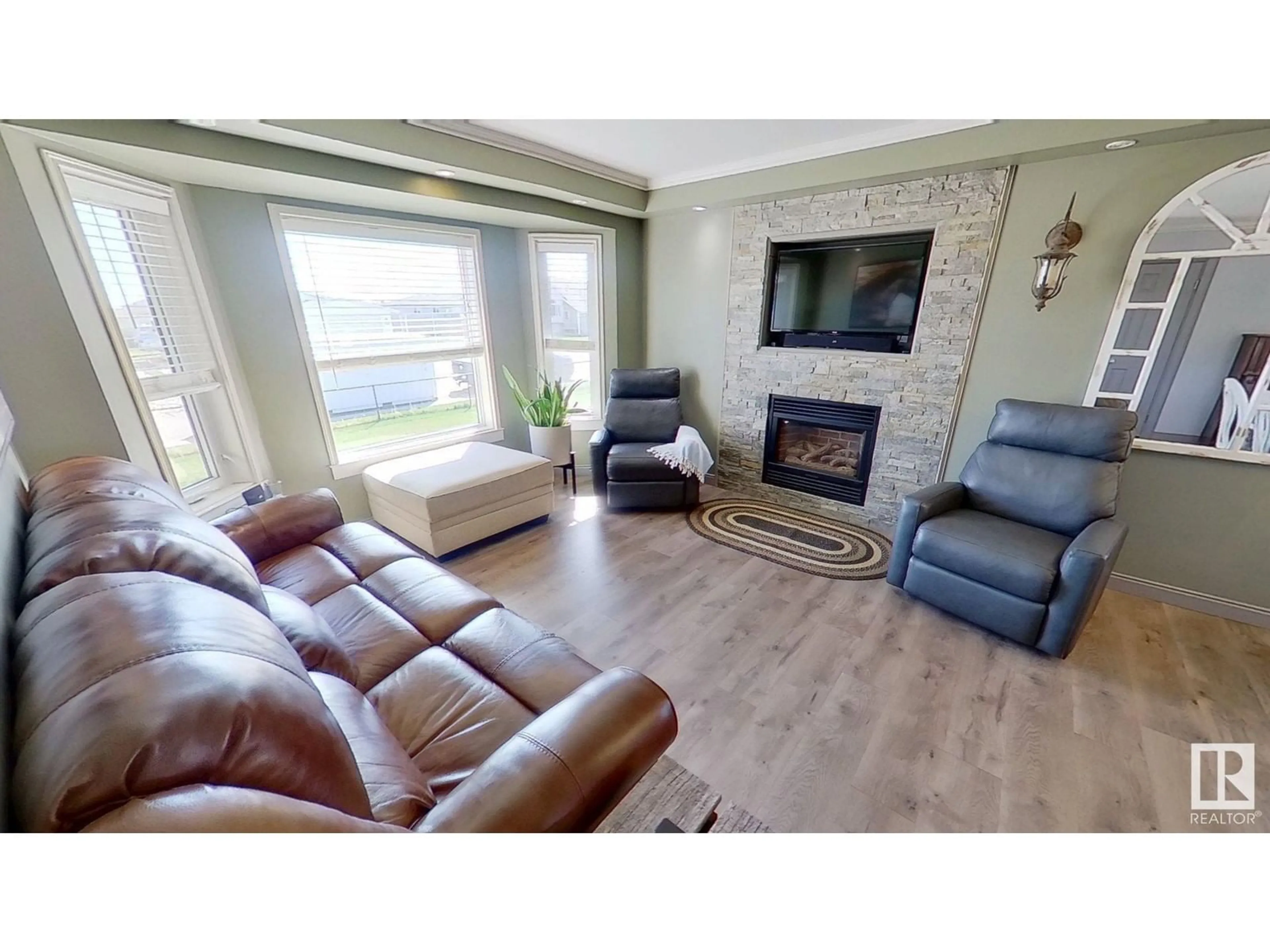 Living room with furniture, wood/laminate floor for 4822 55 ST, Bruderheim Alberta T0B0S0