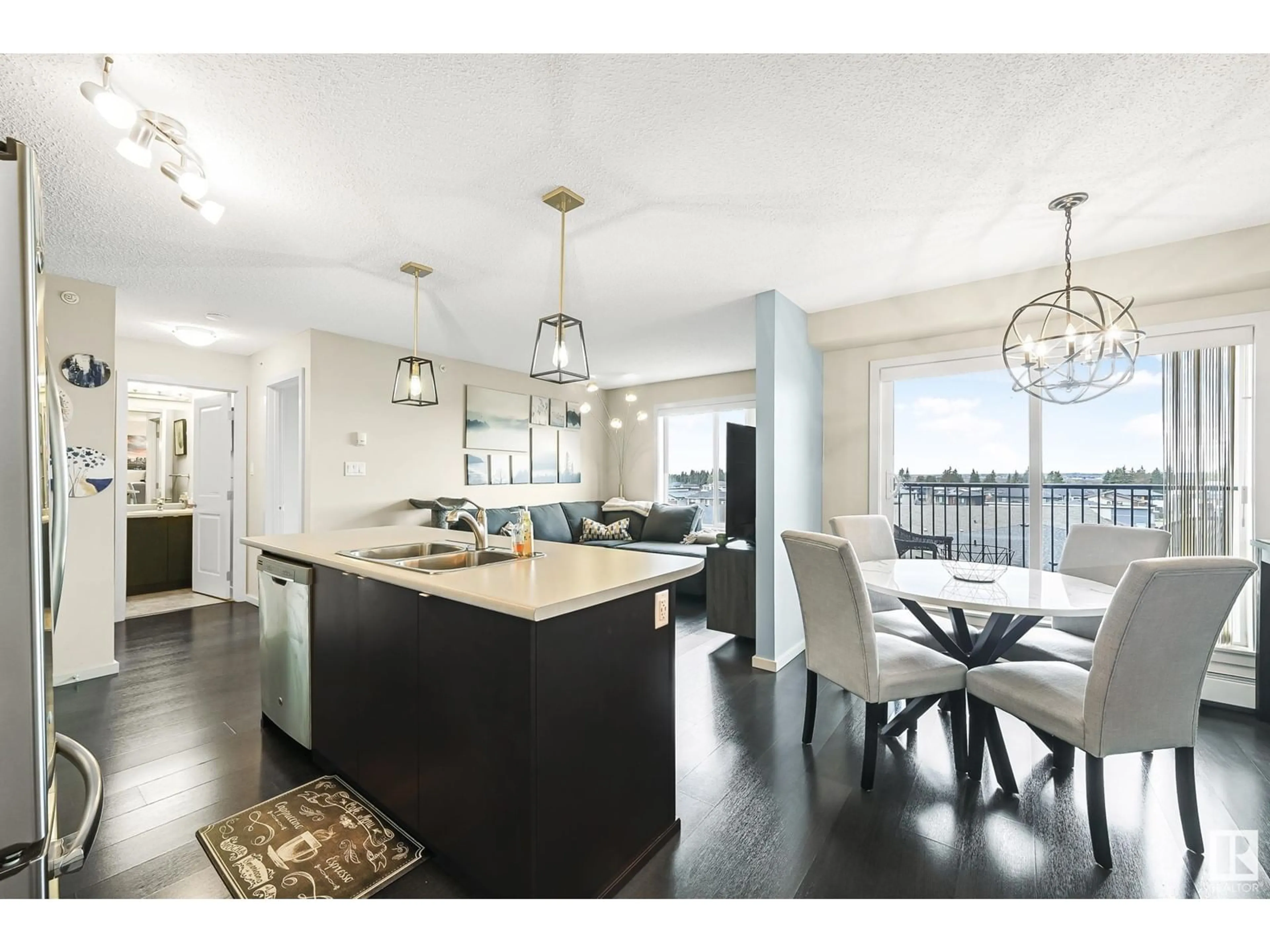 Open concept kitchen, wood/laminate floor for 348 - 445 WINDERMERE RD, Edmonton Alberta T6W2P2