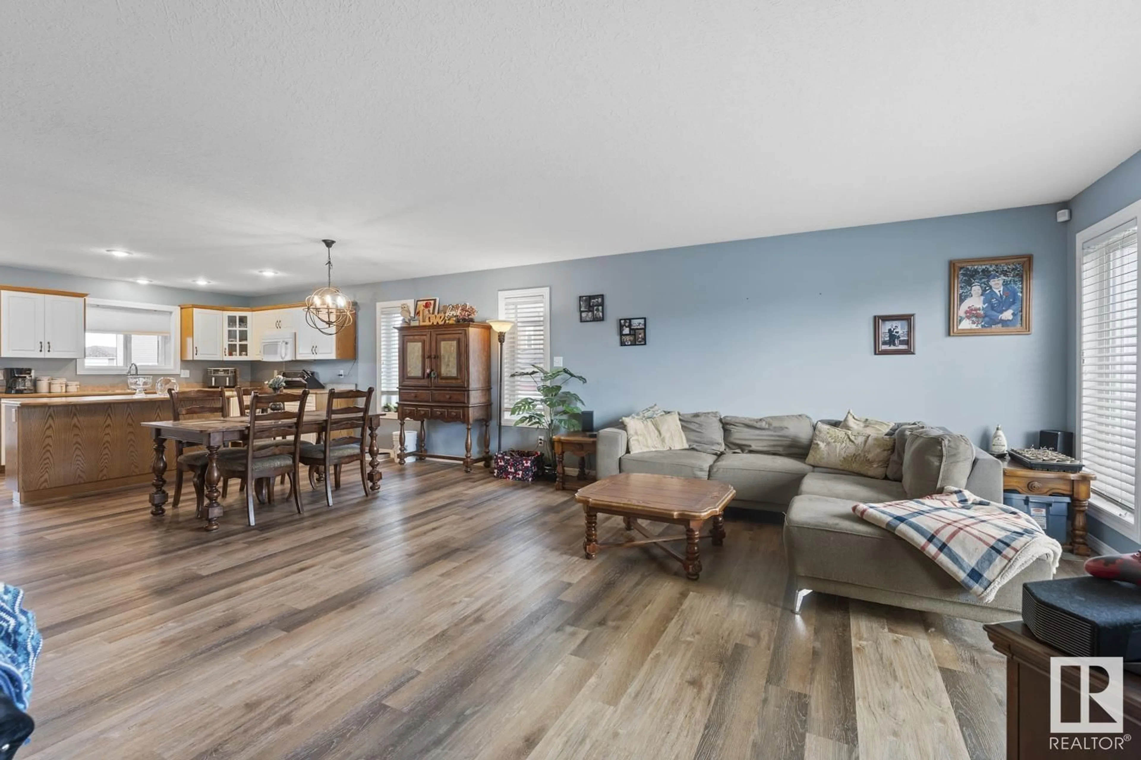 Living room with furniture, wood/laminate floor for 613 WILLOW CR, Cold Lake Alberta T9M1M6