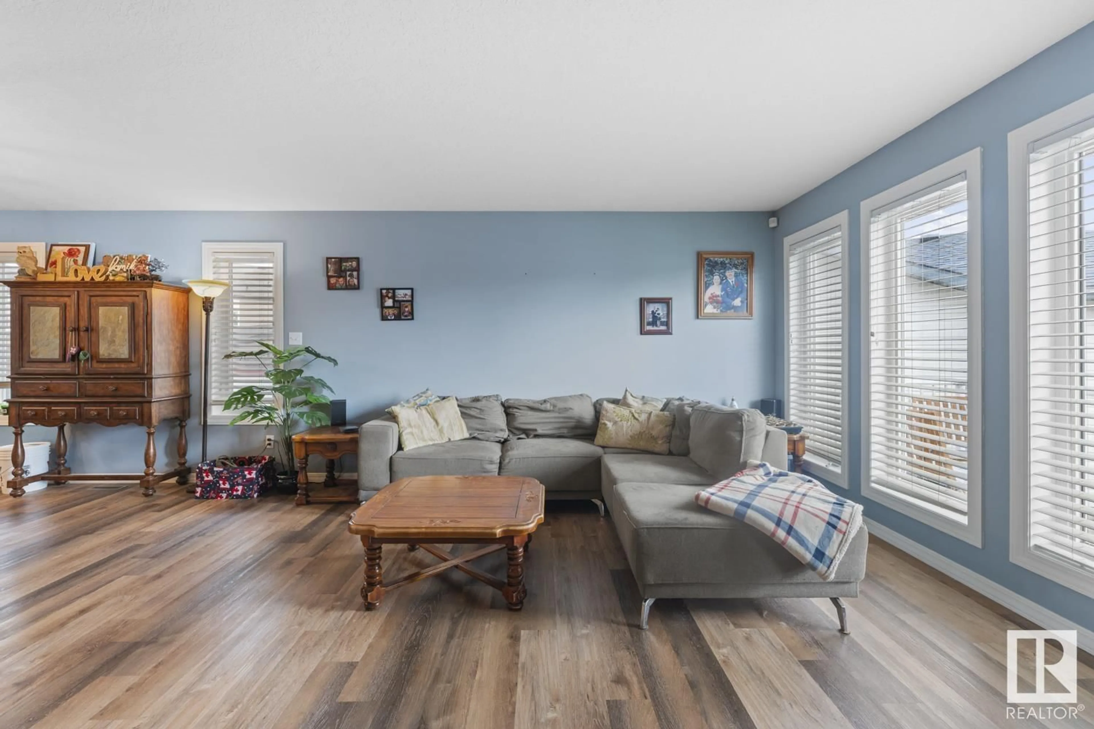 Living room with furniture, wood/laminate floor for 613 WILLOW CR, Cold Lake Alberta T9M1M6