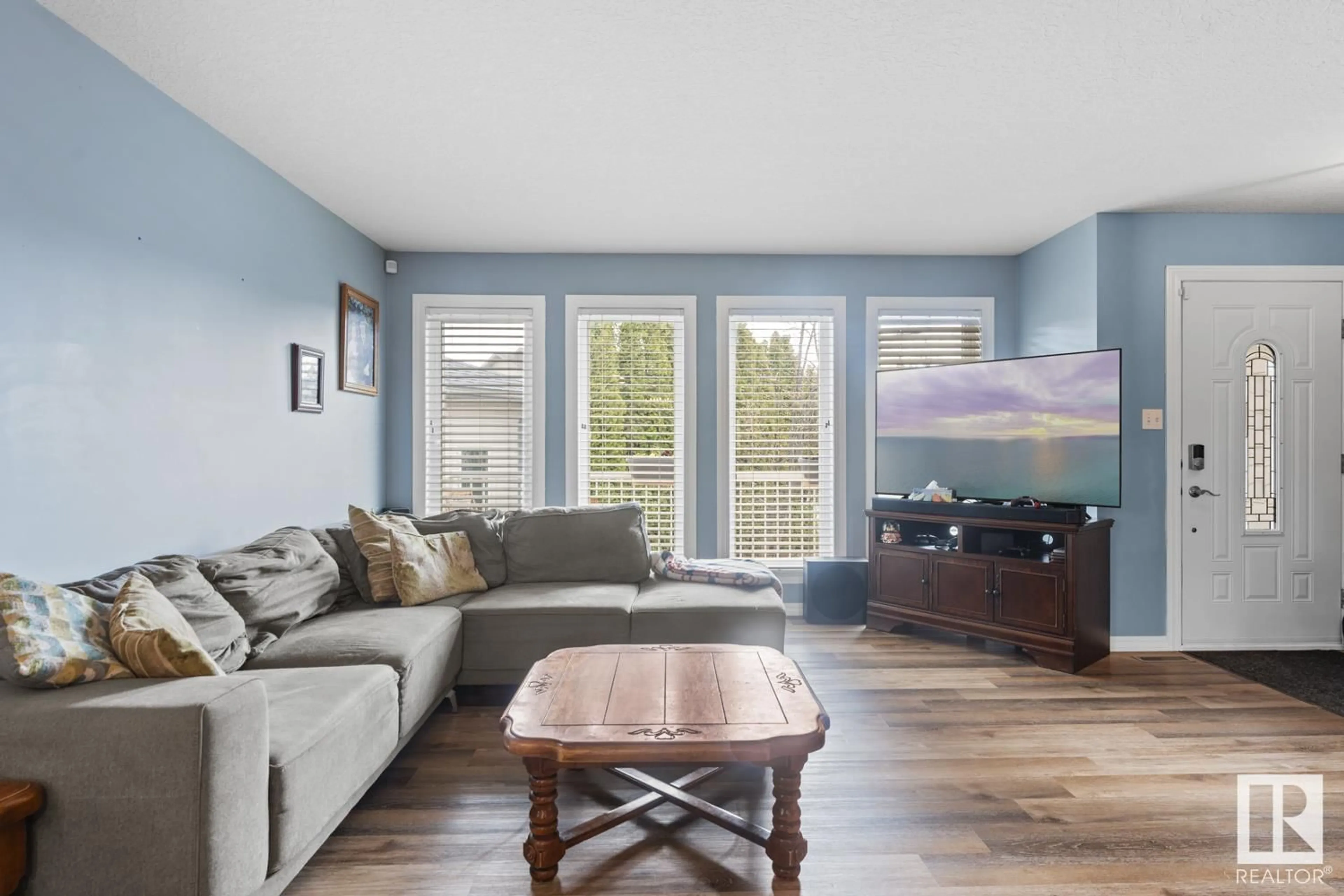 Living room with furniture, wood/laminate floor for 613 WILLOW CR, Cold Lake Alberta T9M1M6