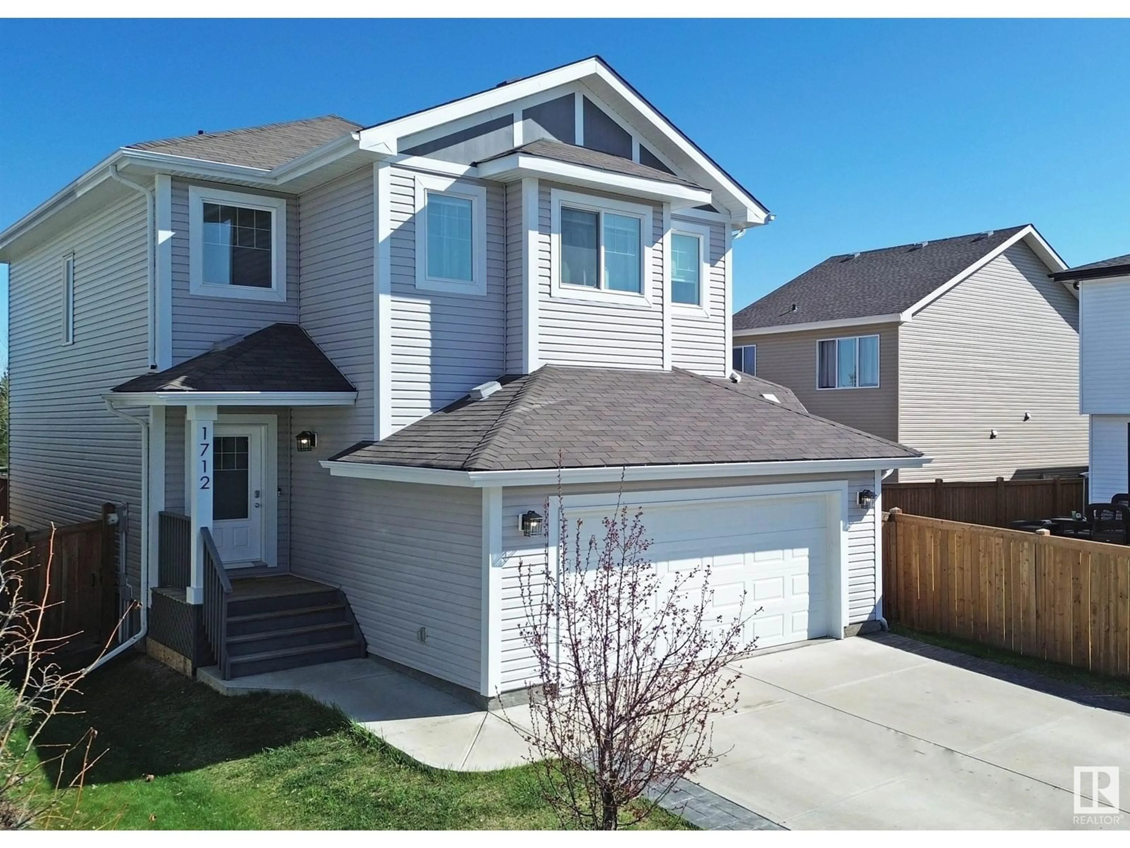 Home with vinyl exterior material, street for 1712 WESTERRA LO, Stony Plain Alberta T7Z0K8