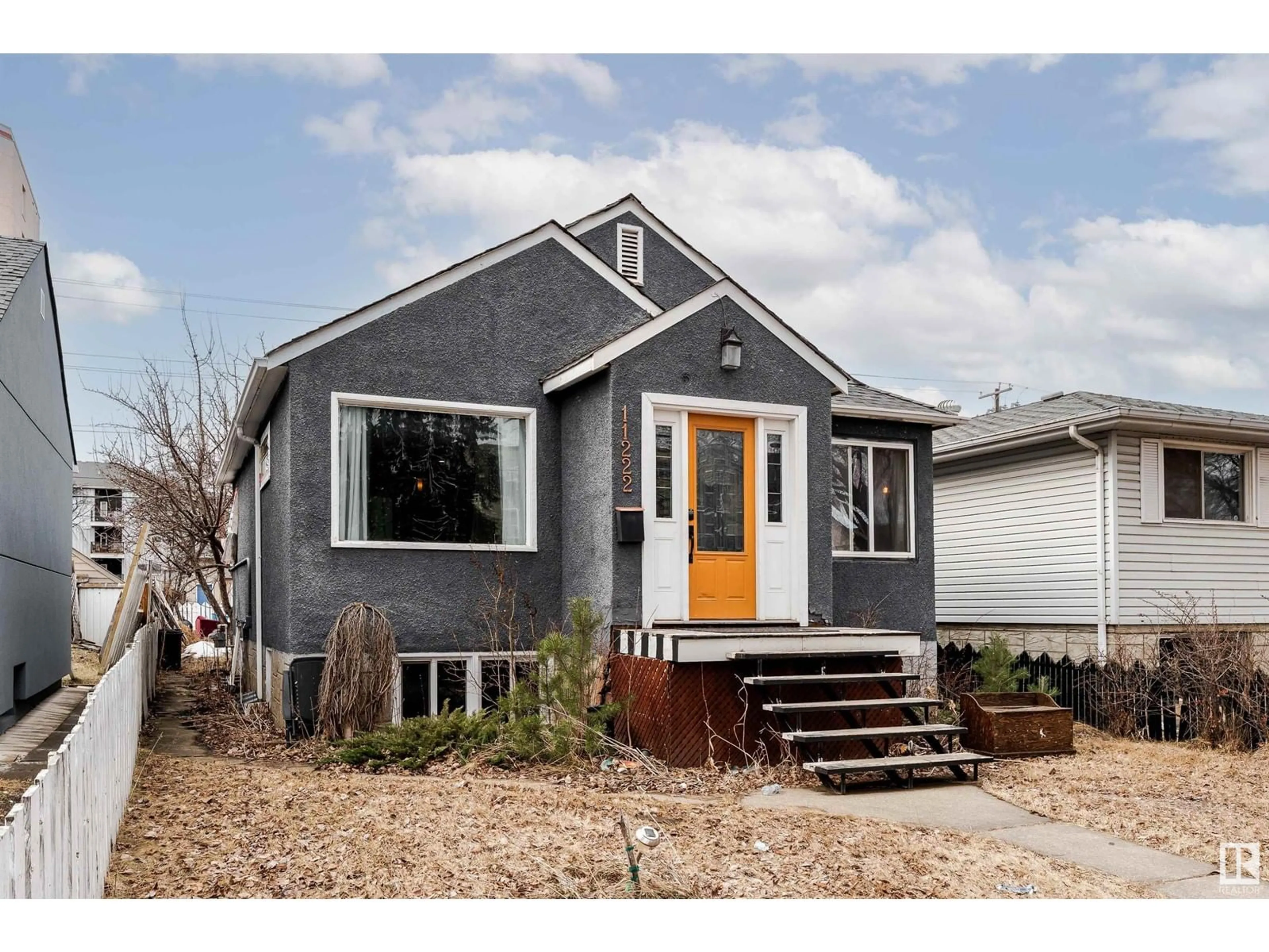 Home with vinyl exterior material, street for NW - 11222 84 ST, Edmonton Alberta T5B3A9