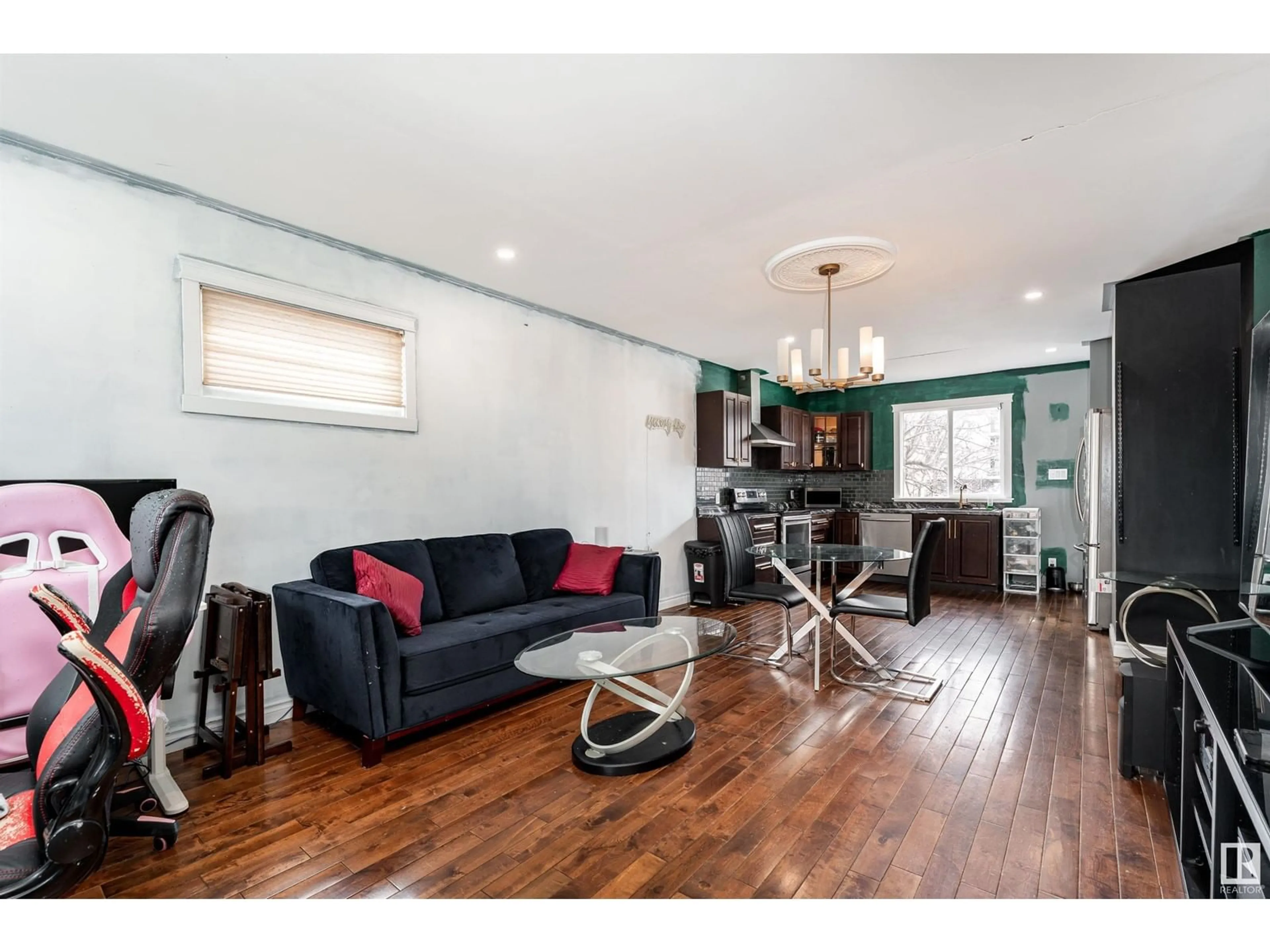 Living room with furniture, wood/laminate floor for NW - 11222 84 ST, Edmonton Alberta T5B3A9