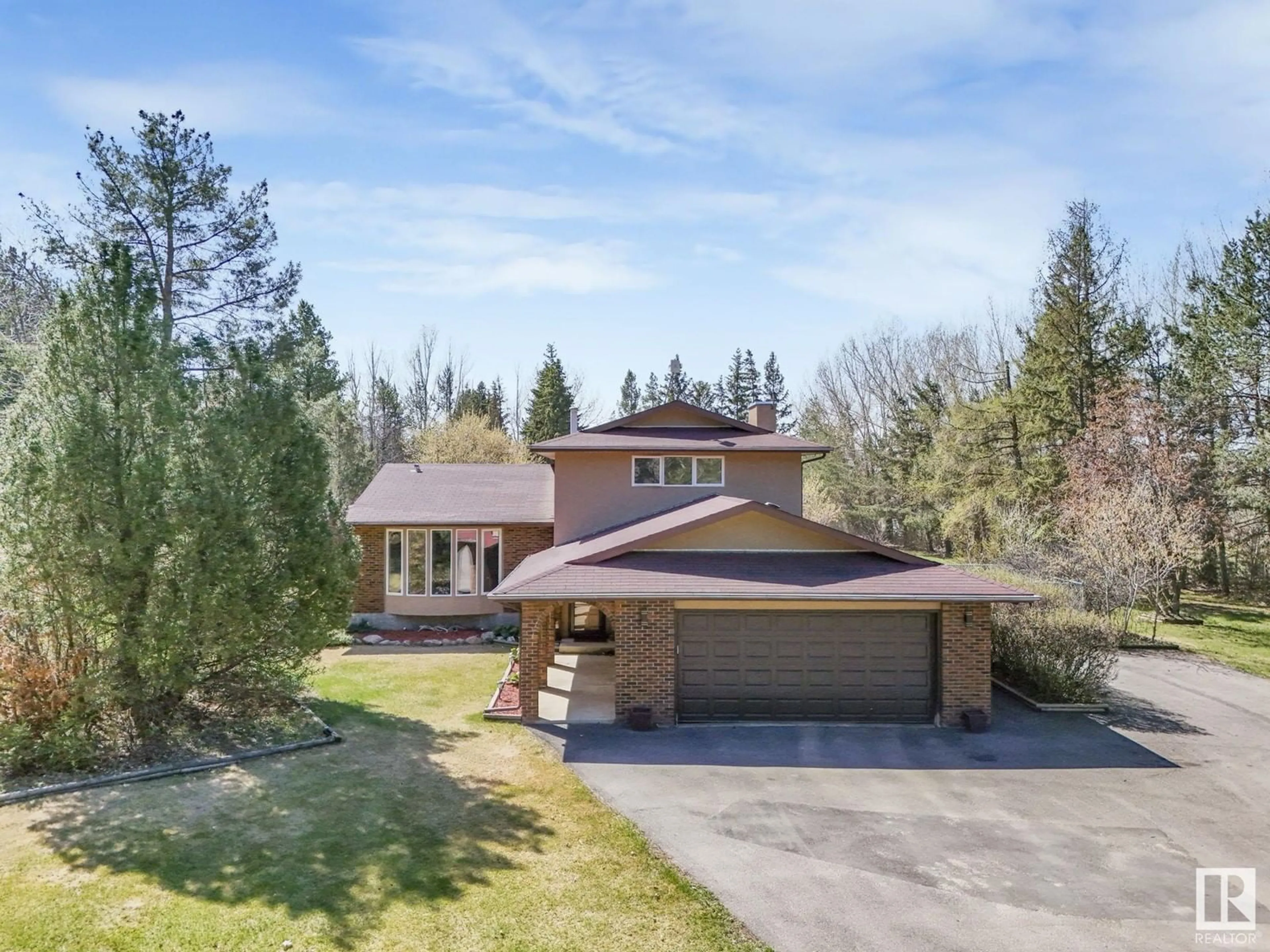 A pic from outside/outdoor area/front of a property/back of a property/a pic from drone, street for 49 24119 TWP ROAD 554, Rural Sturgeon County Alberta T5E5S7