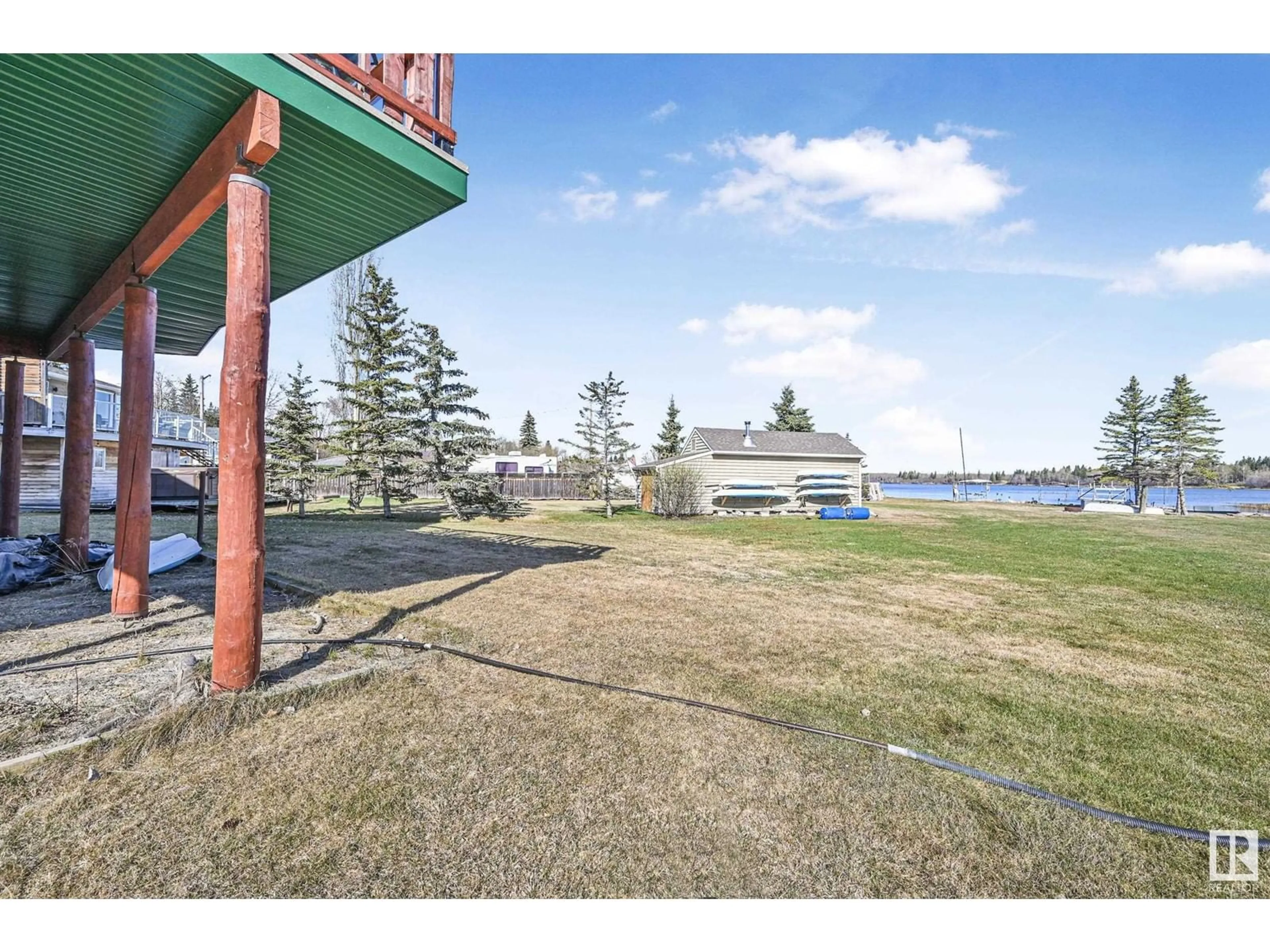 A pic from outside/outdoor area/front of a property/back of a property/a pic from drone, water/lake/river/ocean view for 48003 - 120 RGE ROAD 271, Rural Leduc County Alberta T0C2P0