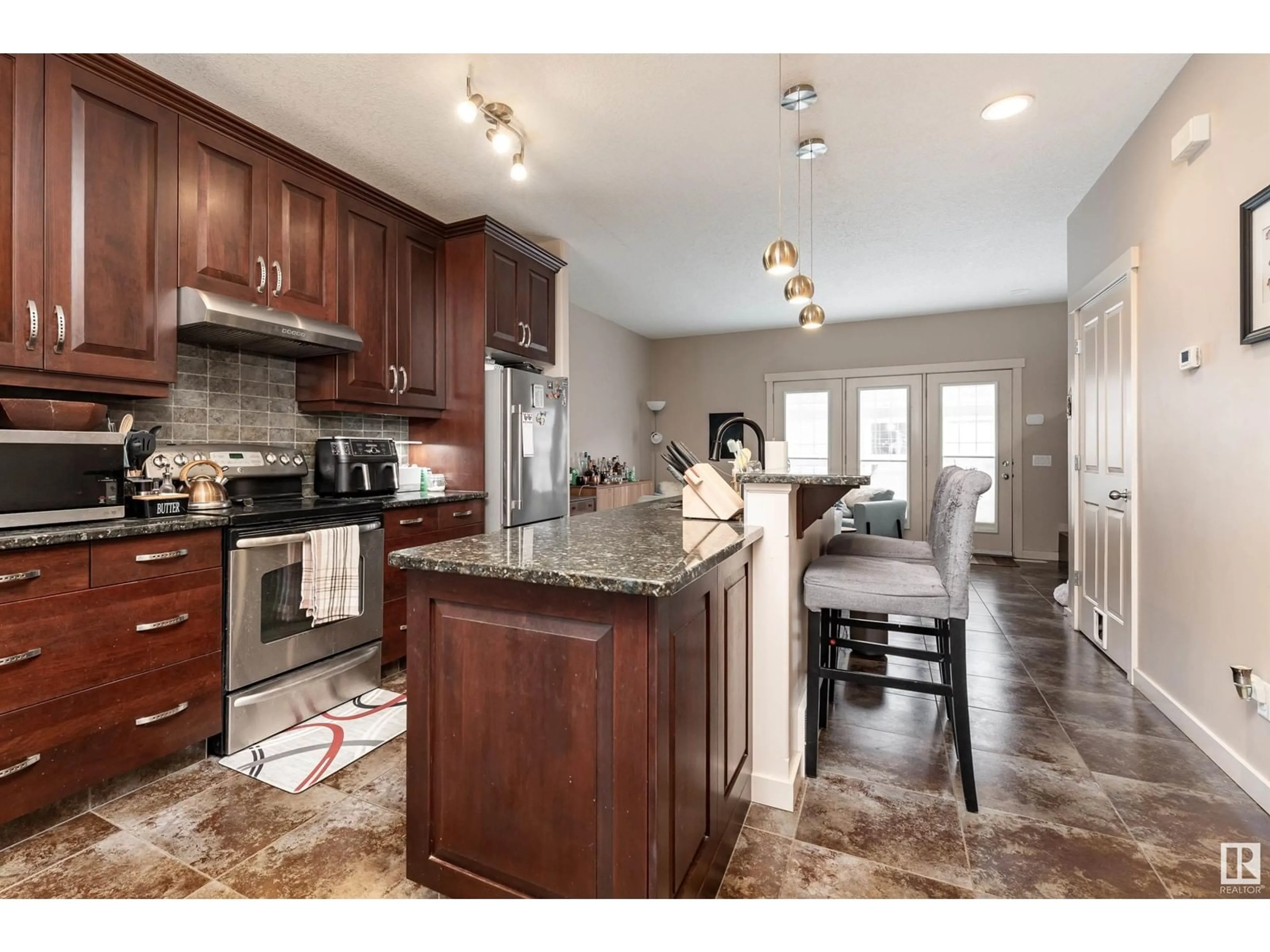 Open concept kitchen, ceramic/tile floor for 1049 GAULT BV, Edmonton Alberta T5E6N5