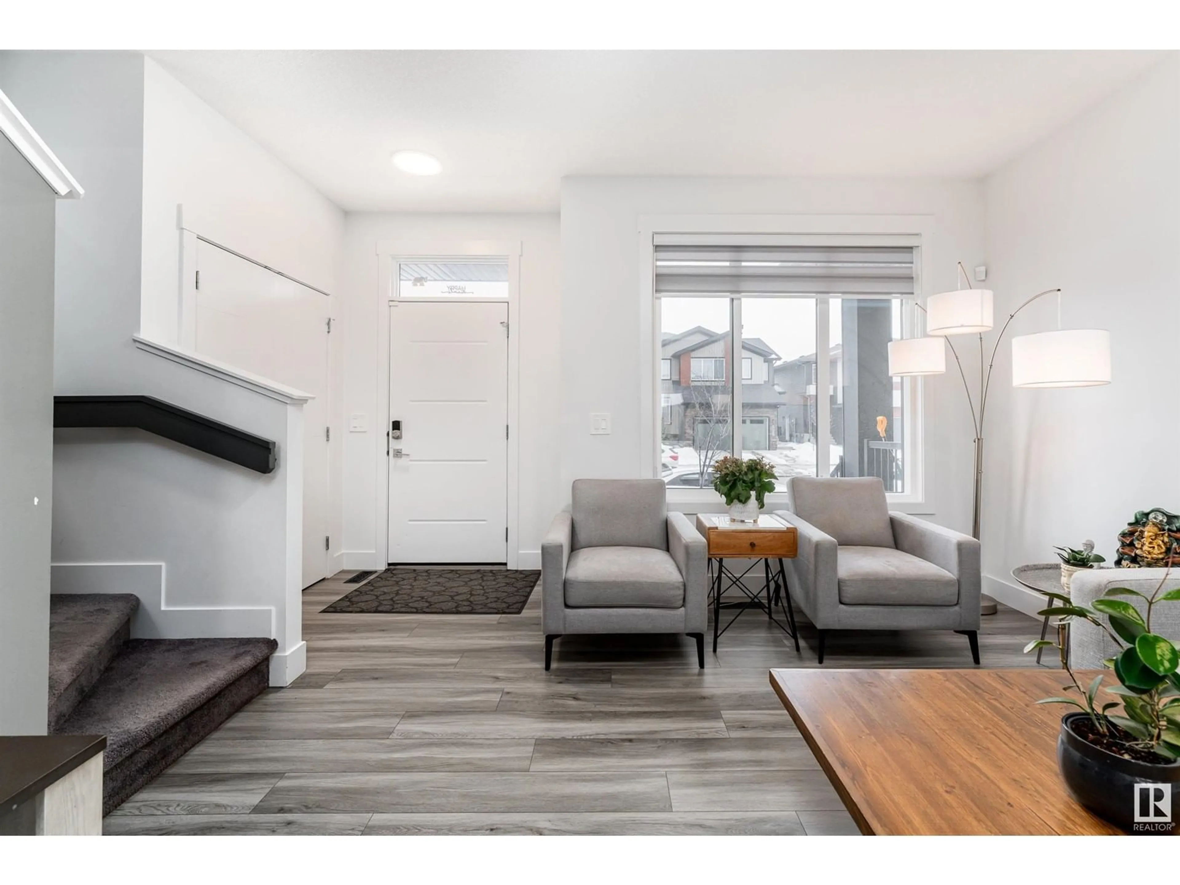 Living room with furniture, wood/laminate floor for 1428 KESWICK DR, Edmonton Alberta T6W4T9