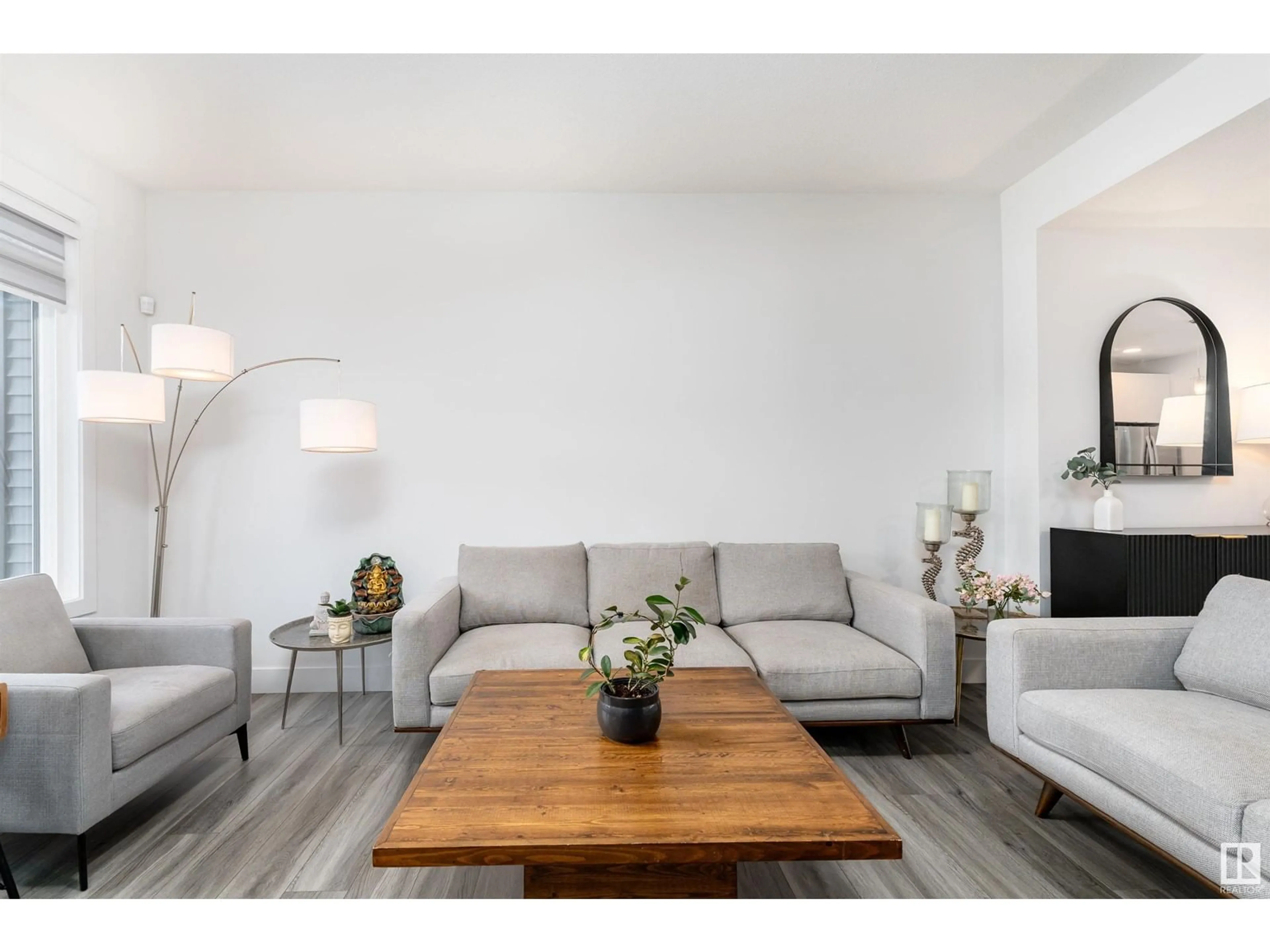 Living room with furniture, wood/laminate floor for 1428 KESWICK DR, Edmonton Alberta T6W4T9