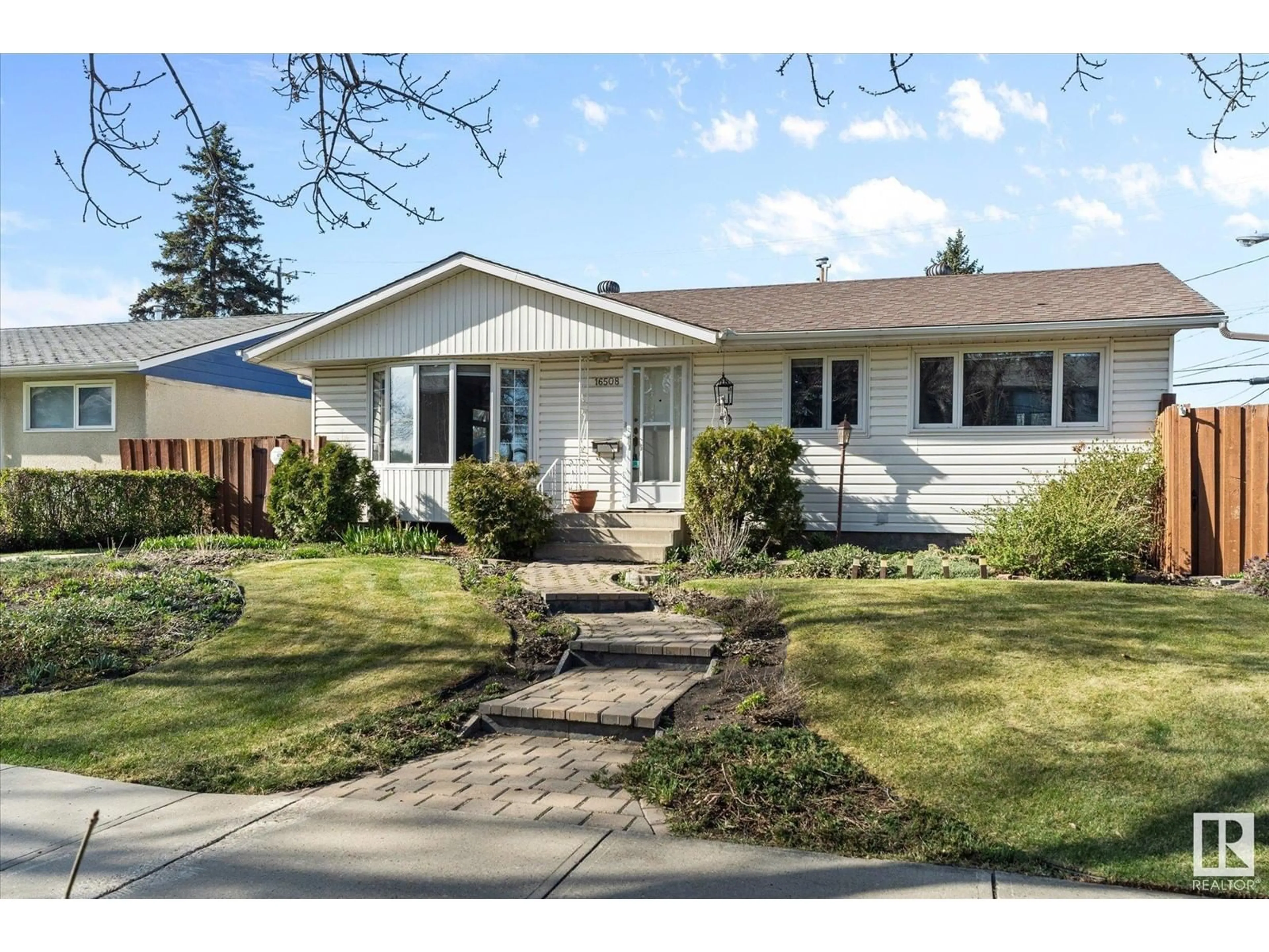 Home with vinyl exterior material, street for 16508 83 AV, Edmonton Alberta T5R3W1