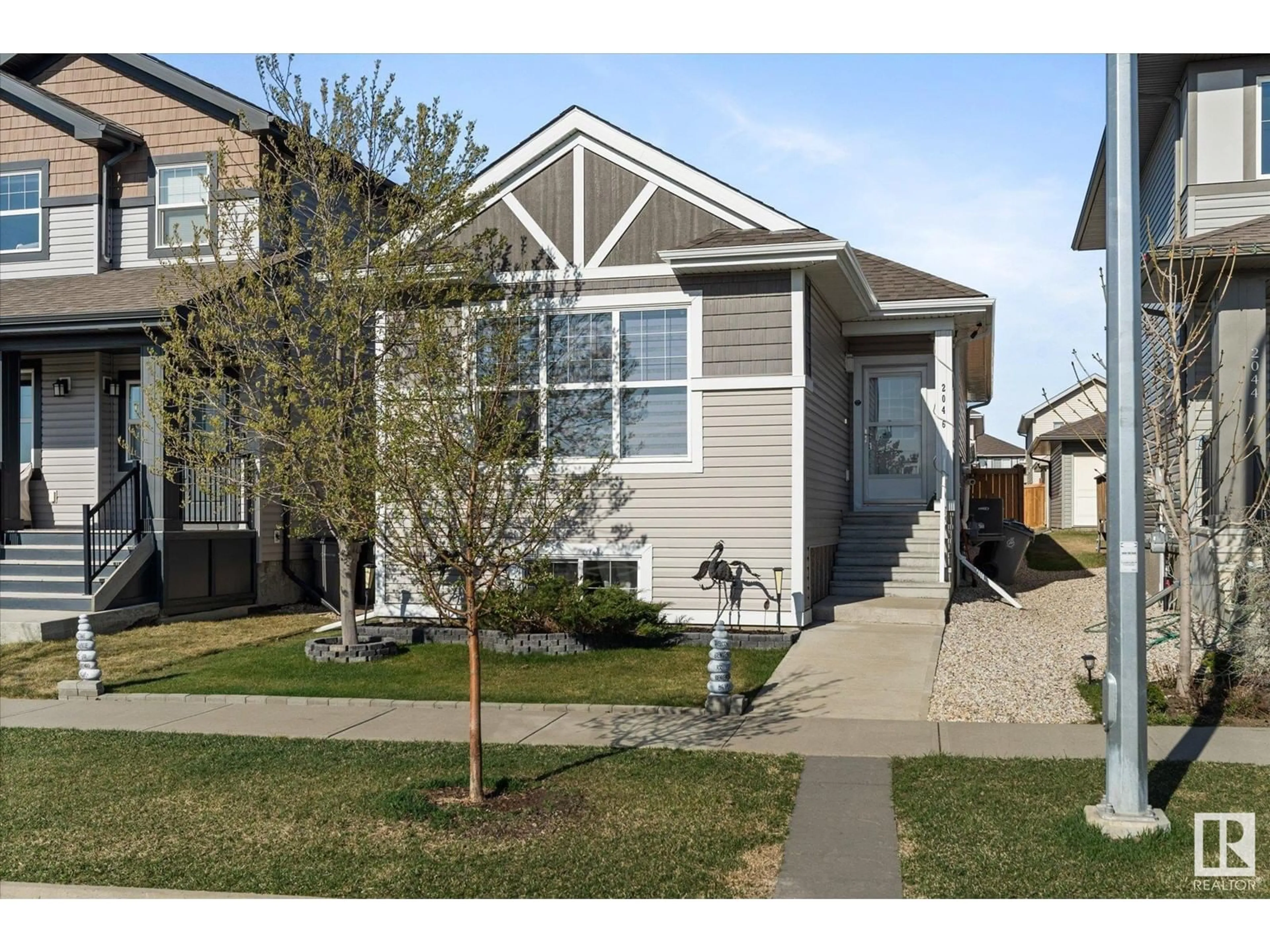 Home with vinyl exterior material, street for 2046 SOUTH CREEK DR, Stony Plain Alberta T7Z0J8