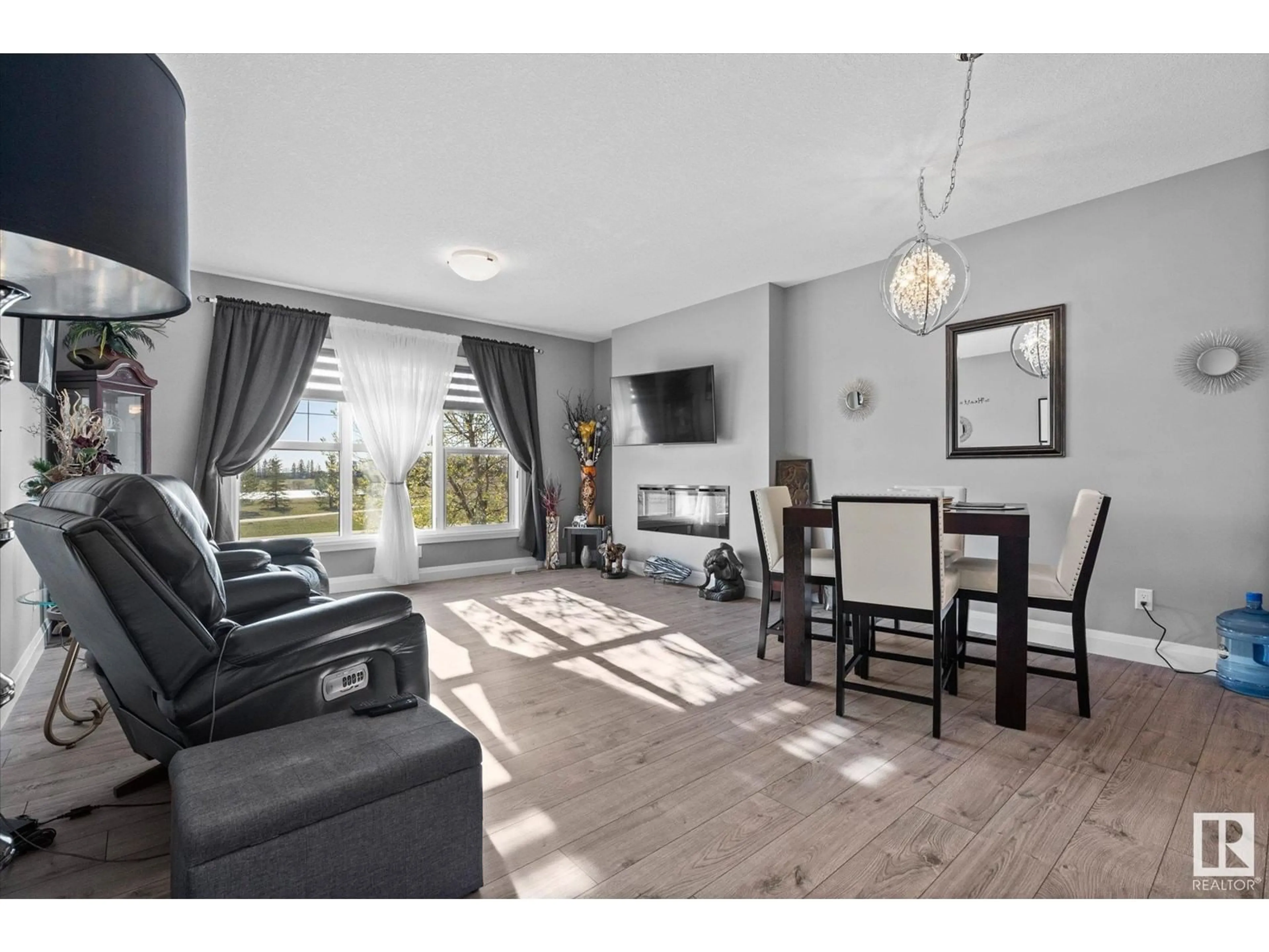 Living room with furniture, wood/laminate floor for 2046 SOUTH CREEK DR, Stony Plain Alberta T7Z0J8