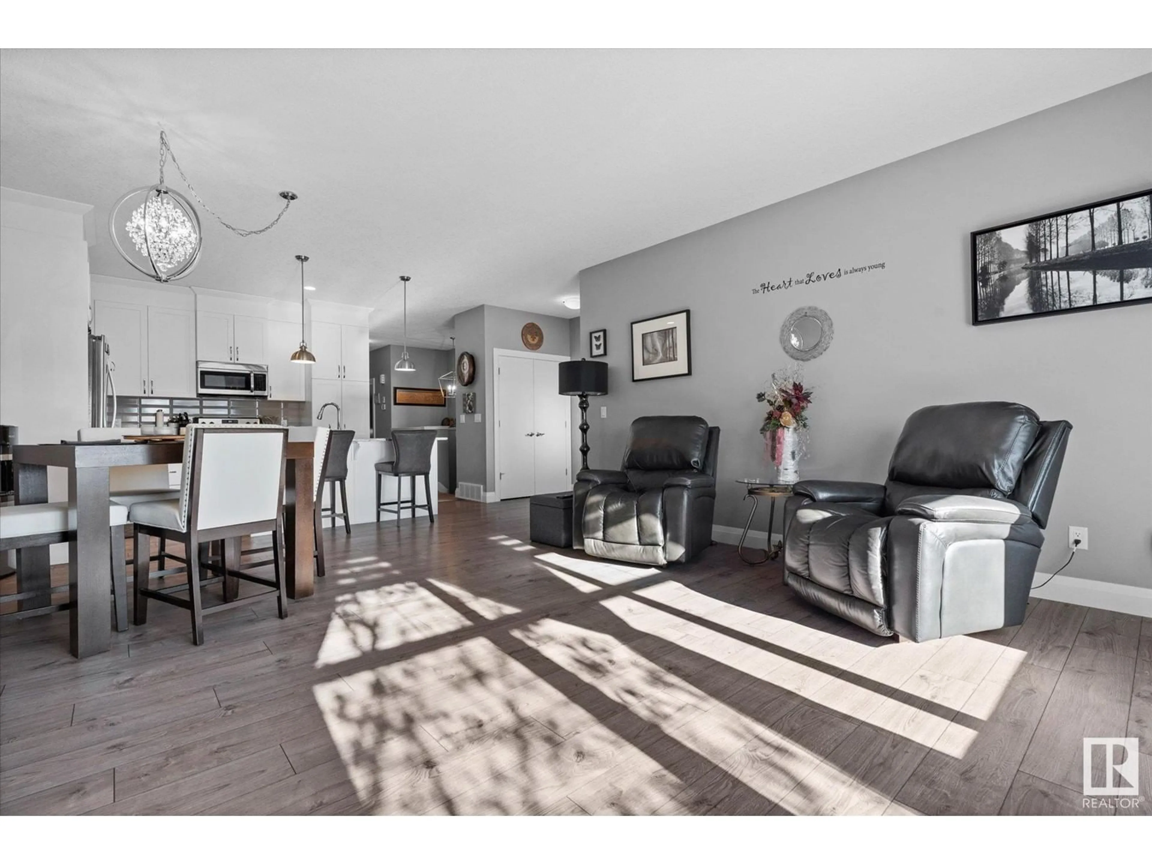 Living room with furniture, wood/laminate floor for 2046 SOUTH CREEK DR, Stony Plain Alberta T7Z0J8