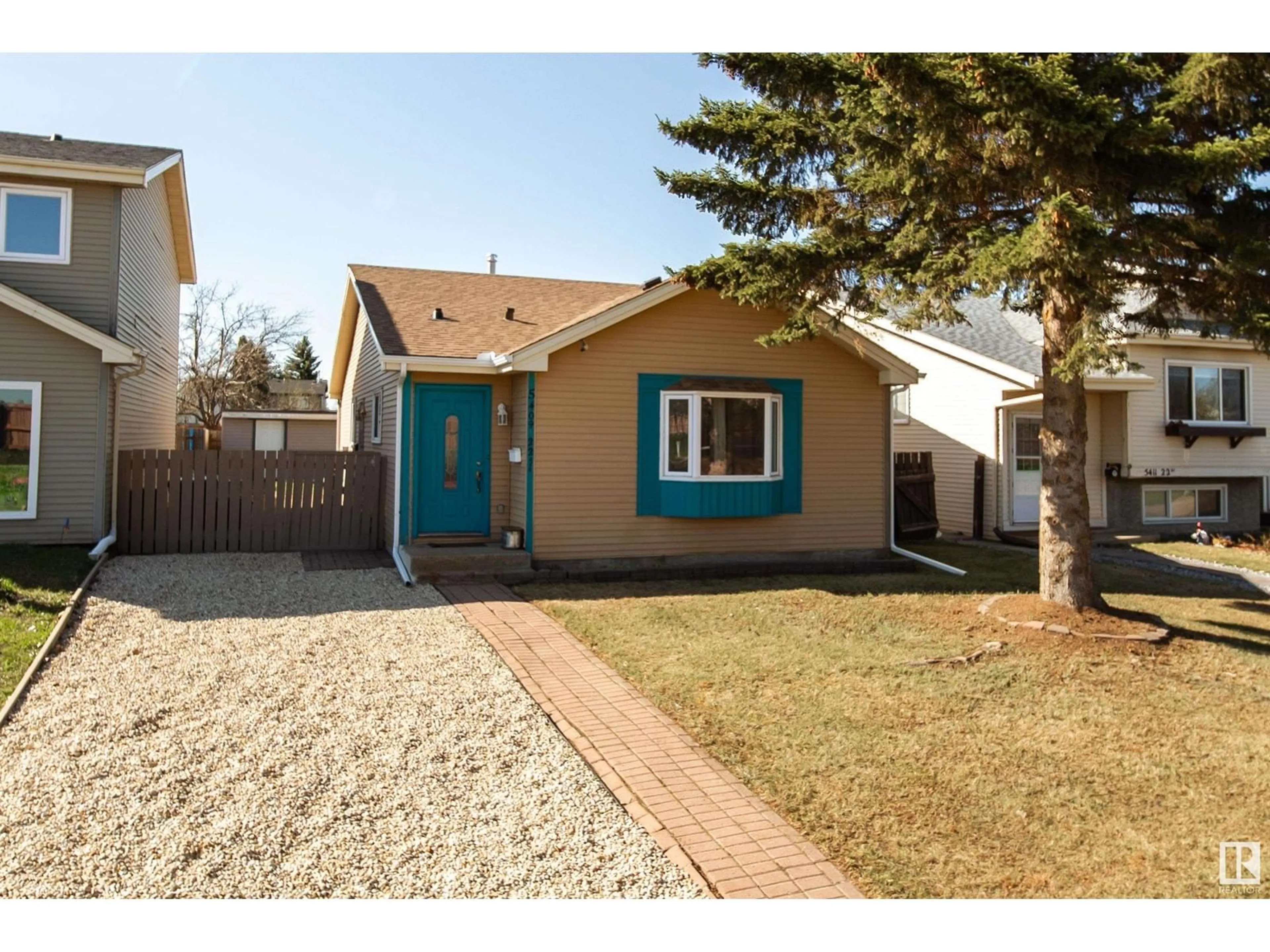 Home with vinyl exterior material, street for 5409 22 AV, Edmonton Alberta T6L4V1