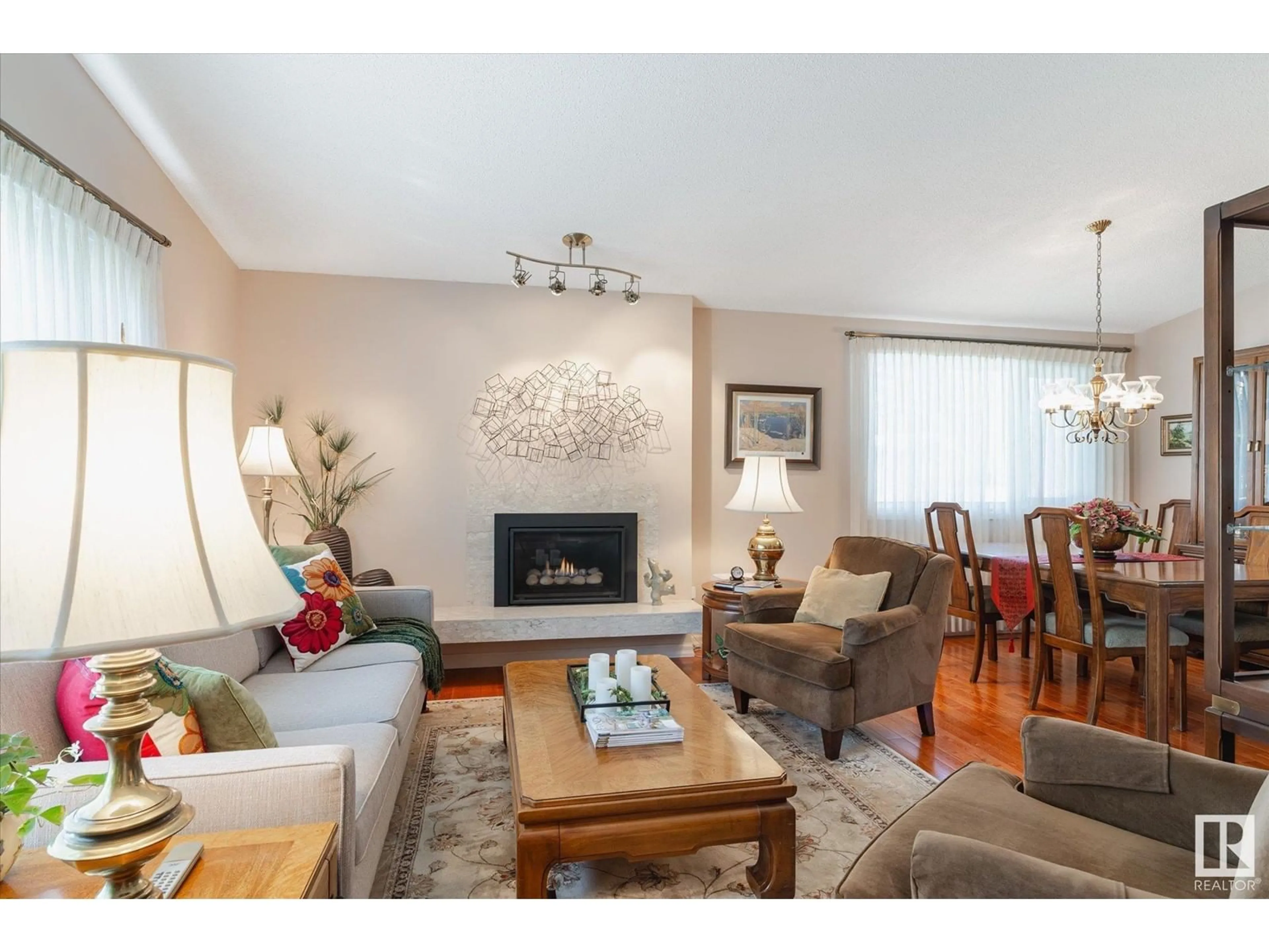 Living room with furniture, wood/laminate floor for 3843 110 ST, Edmonton Alberta T6J1E5