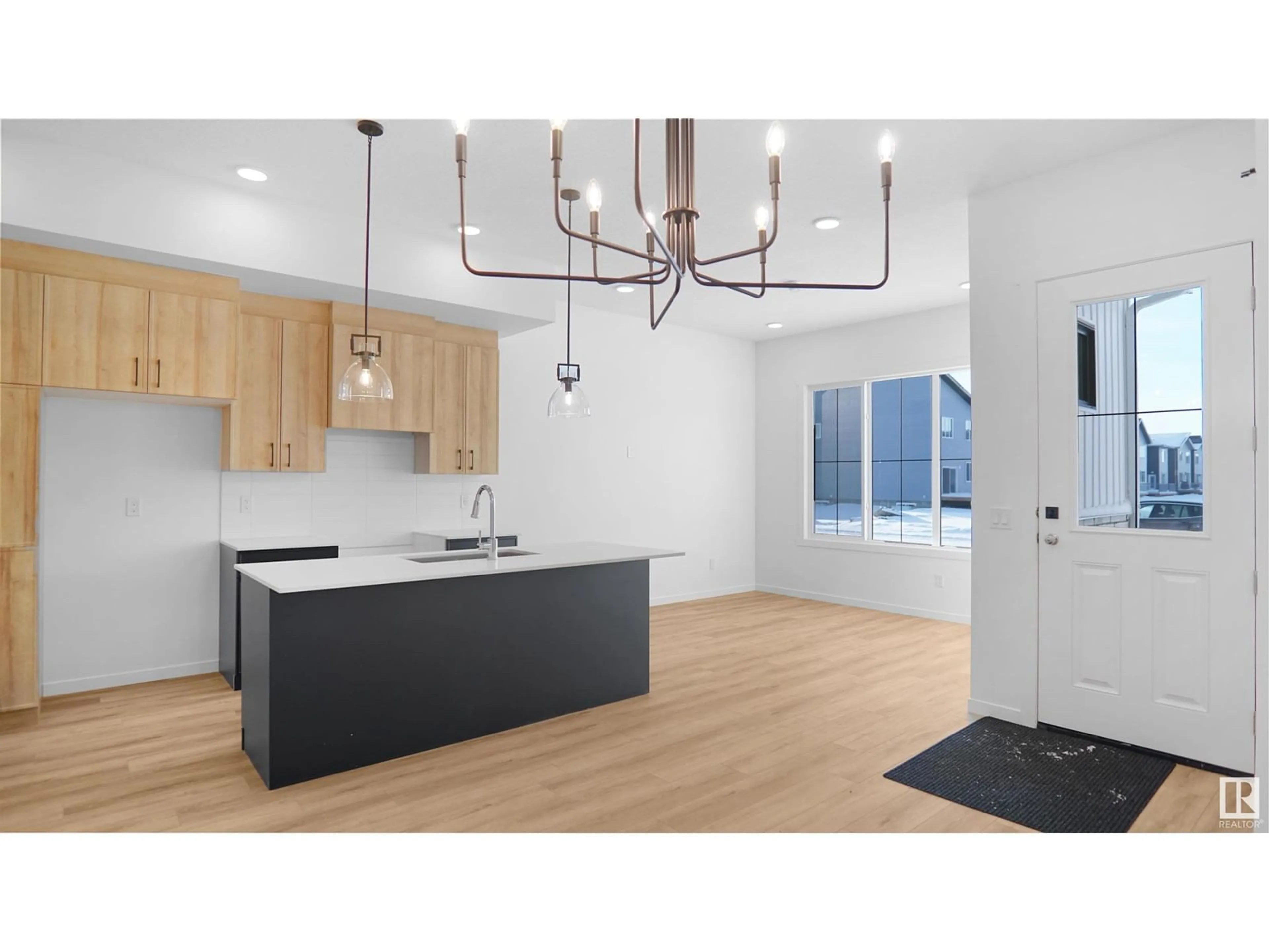 Open concept kitchen, wood/laminate floor for 15 DEER MEADOW CR, Fort Saskatchewan Alberta T8L0X9
