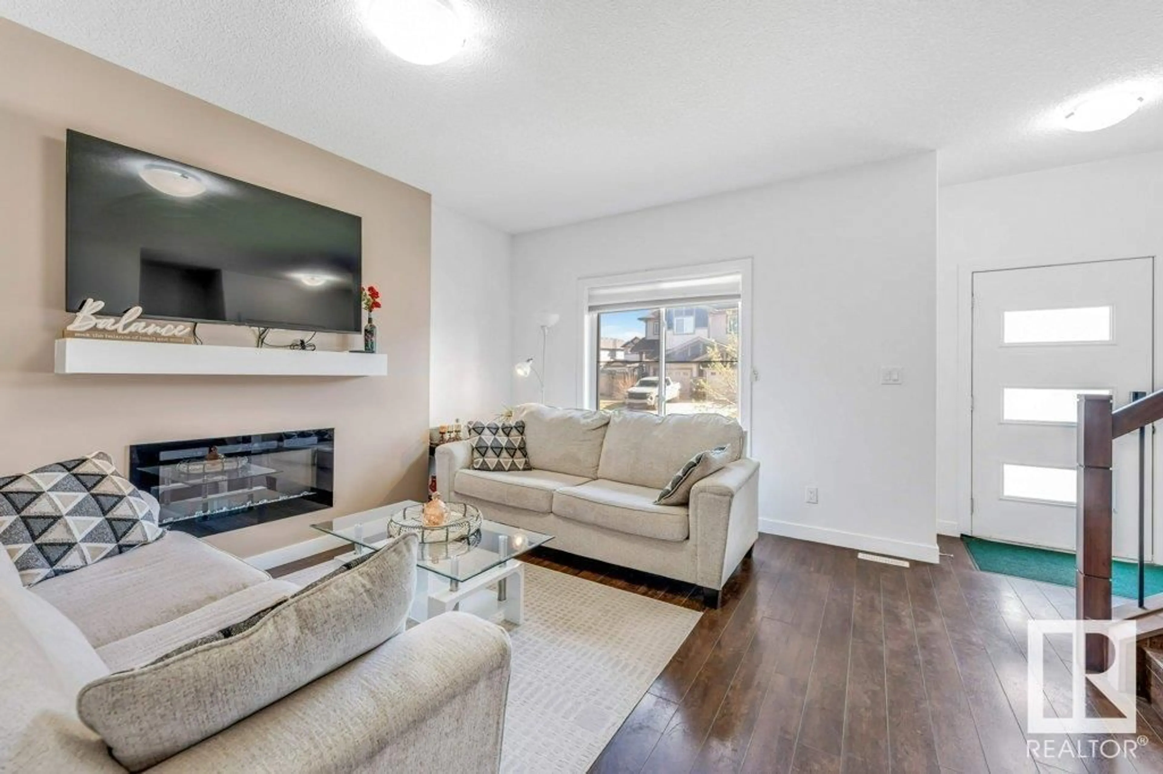 Living room with furniture, unknown for 9201 COOPER CR SW, Edmonton Alberta T6W3L1