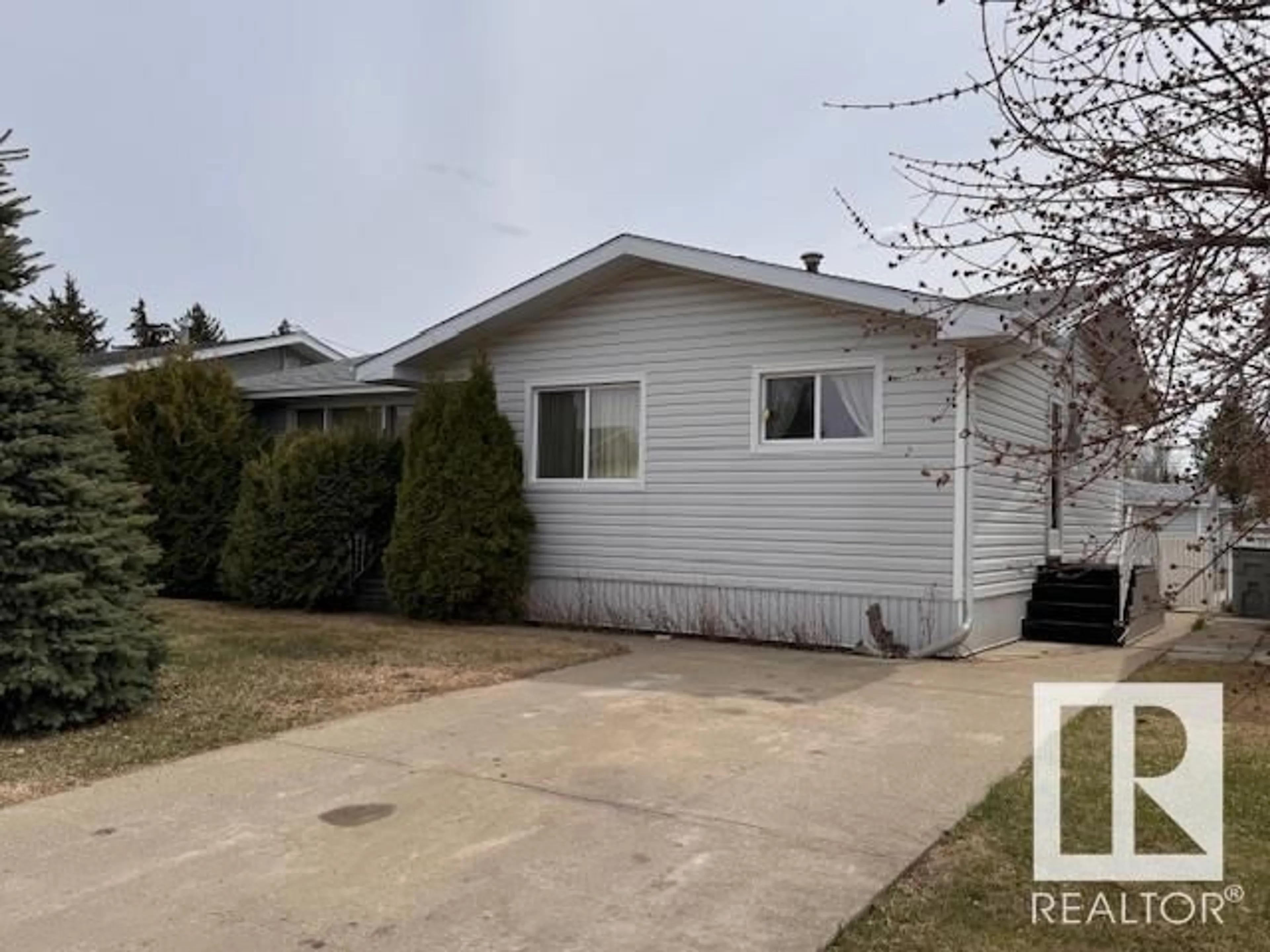 Home with vinyl exterior material, street for 10551 103 ST, Westlock Alberta T7P1K9