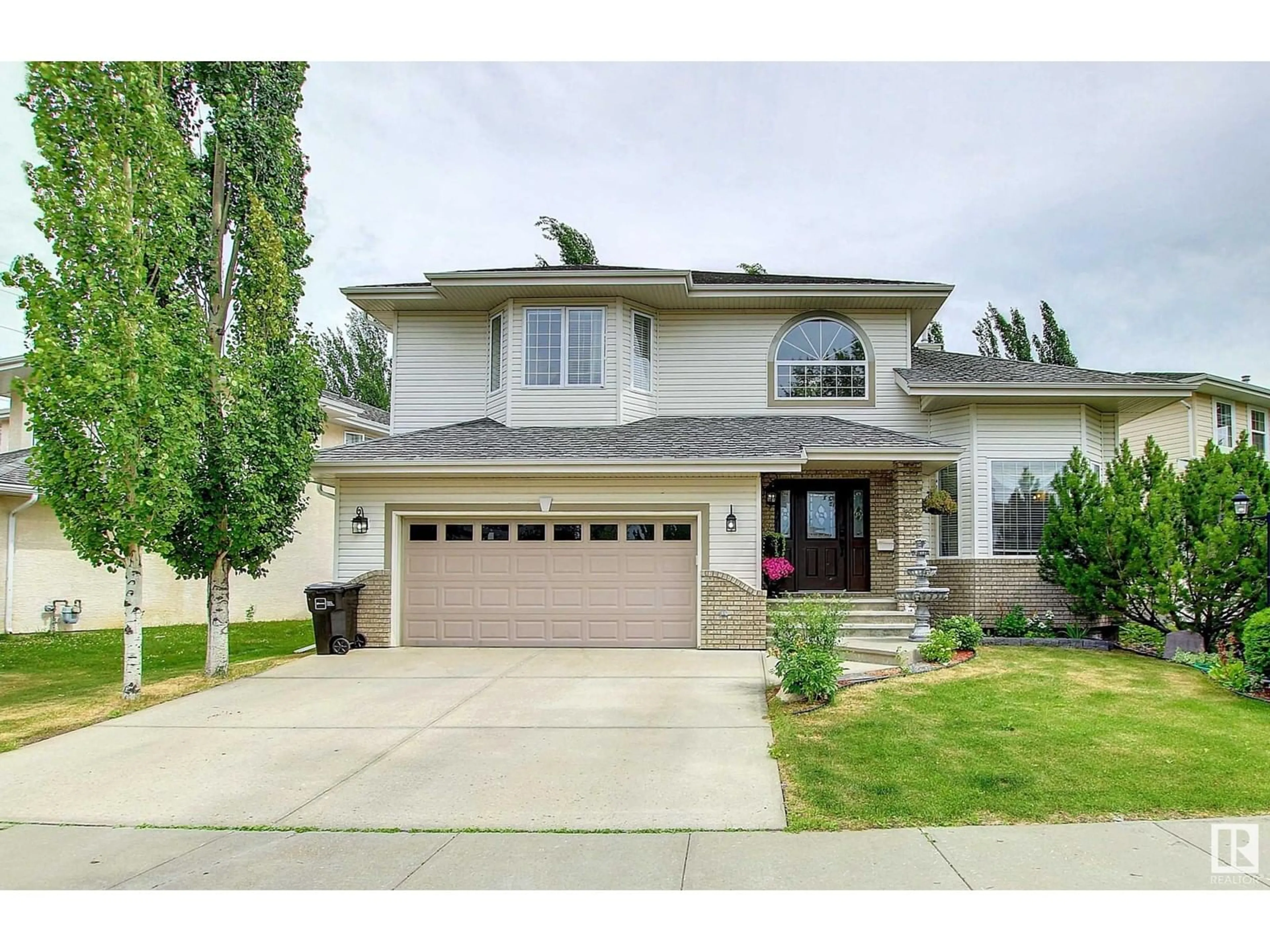 Home with vinyl exterior material, street for 329 HEATH RD, Edmonton Alberta T6R2X4