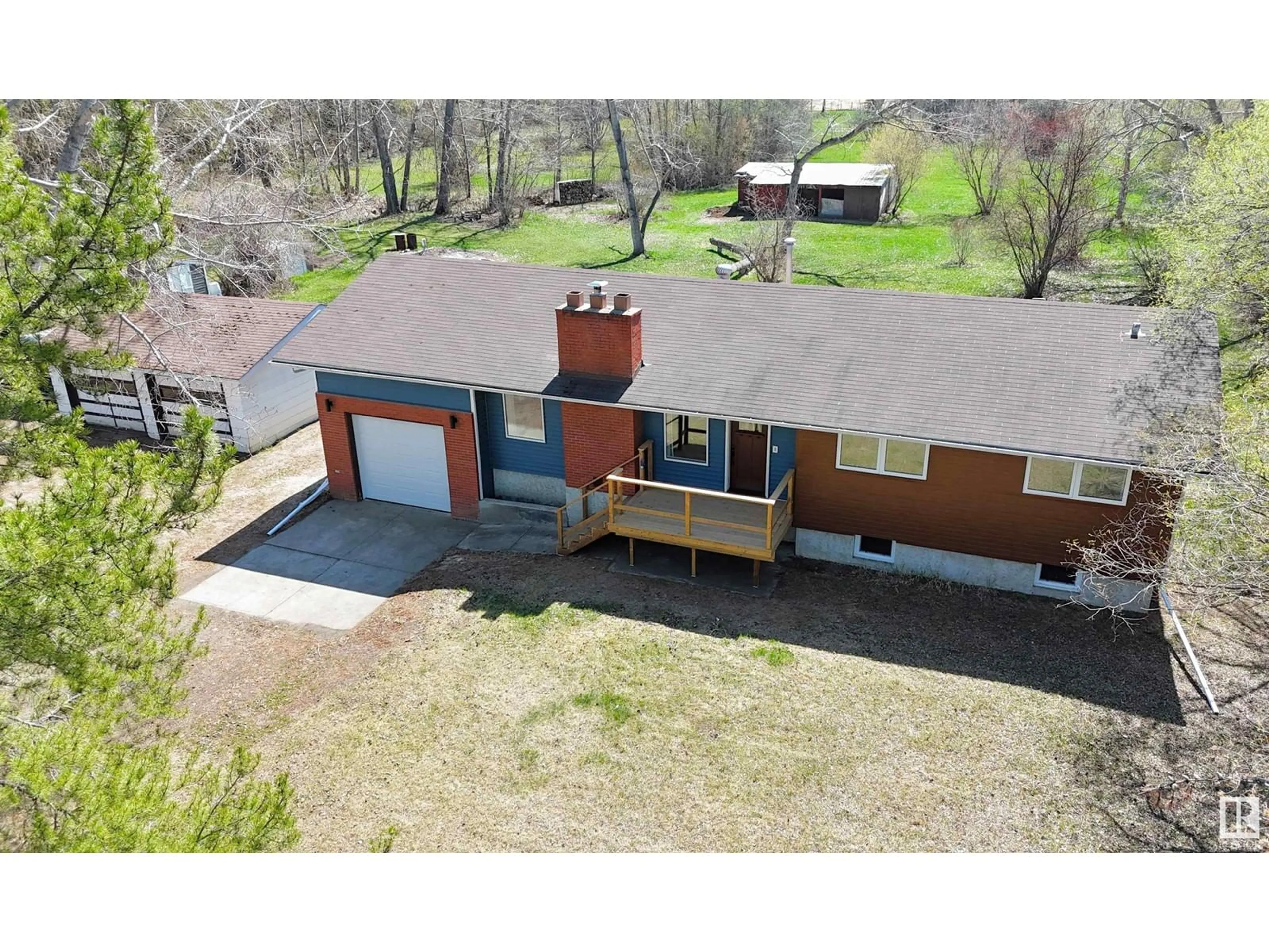 A pic from outside/outdoor area/front of a property/back of a property/a pic from drone, street for 17 - 53219 RGE ROAD 271, Rural Parkland County Alberta T7X3L9