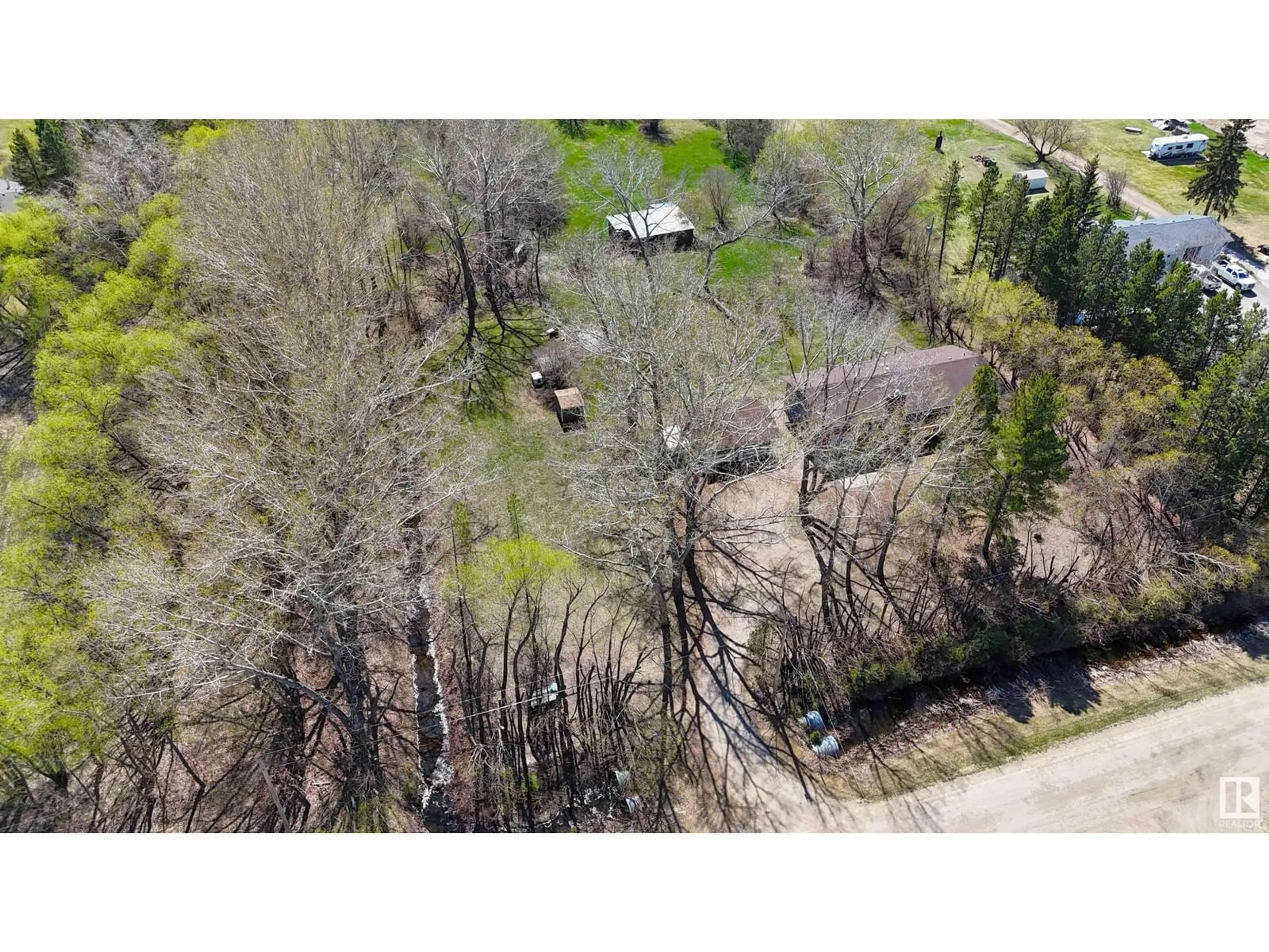 A pic from outside/outdoor area/front of a property/back of a property/a pic from drone, forest/trees view for 17 - 53219 RGE ROAD 271, Rural Parkland County Alberta T7X3L9