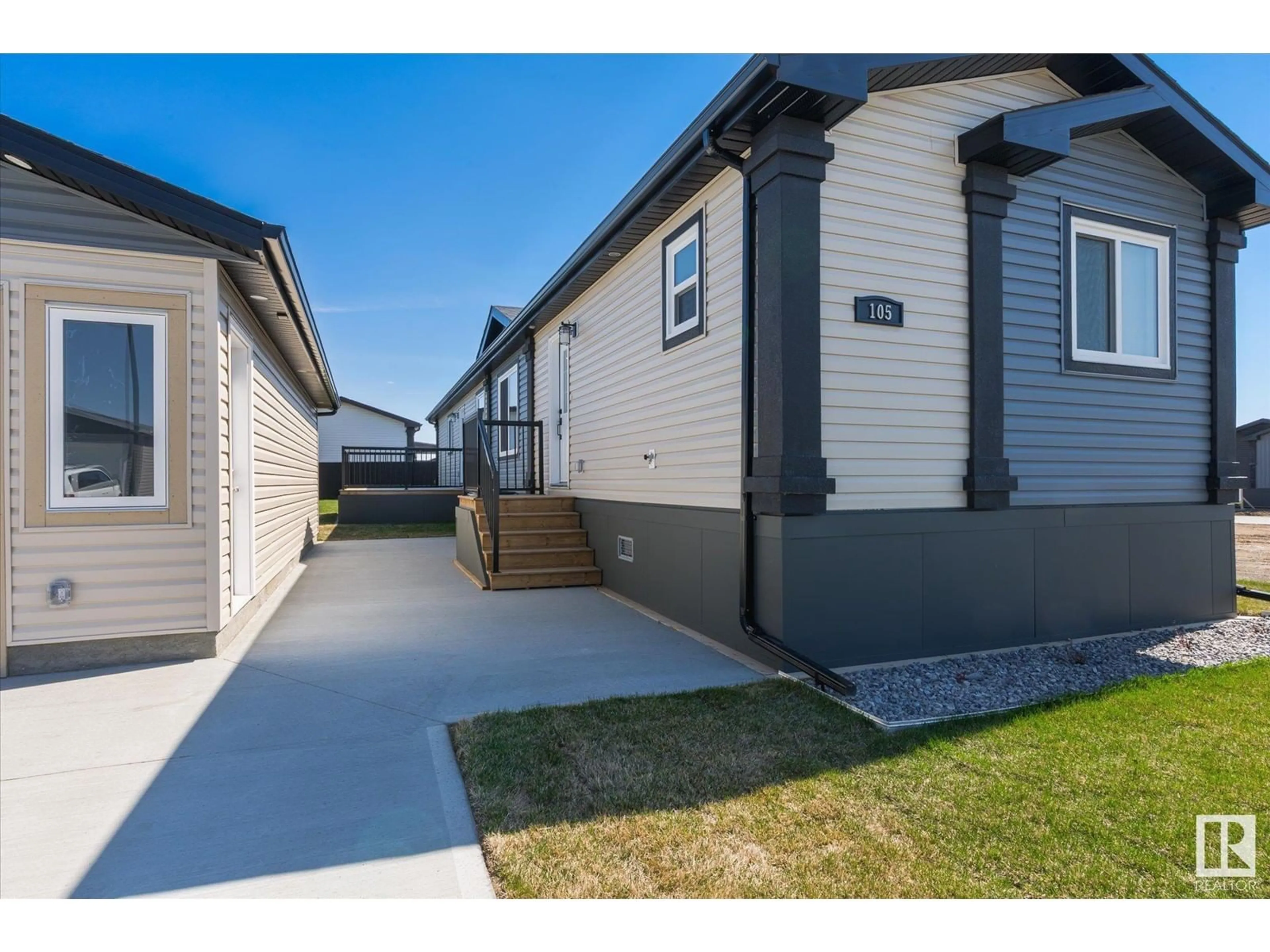 A pic from outside/outdoor area/front of a property/back of a property/a pic from drone, street for 105 LILY LN, Morinville Alberta T8R2P7