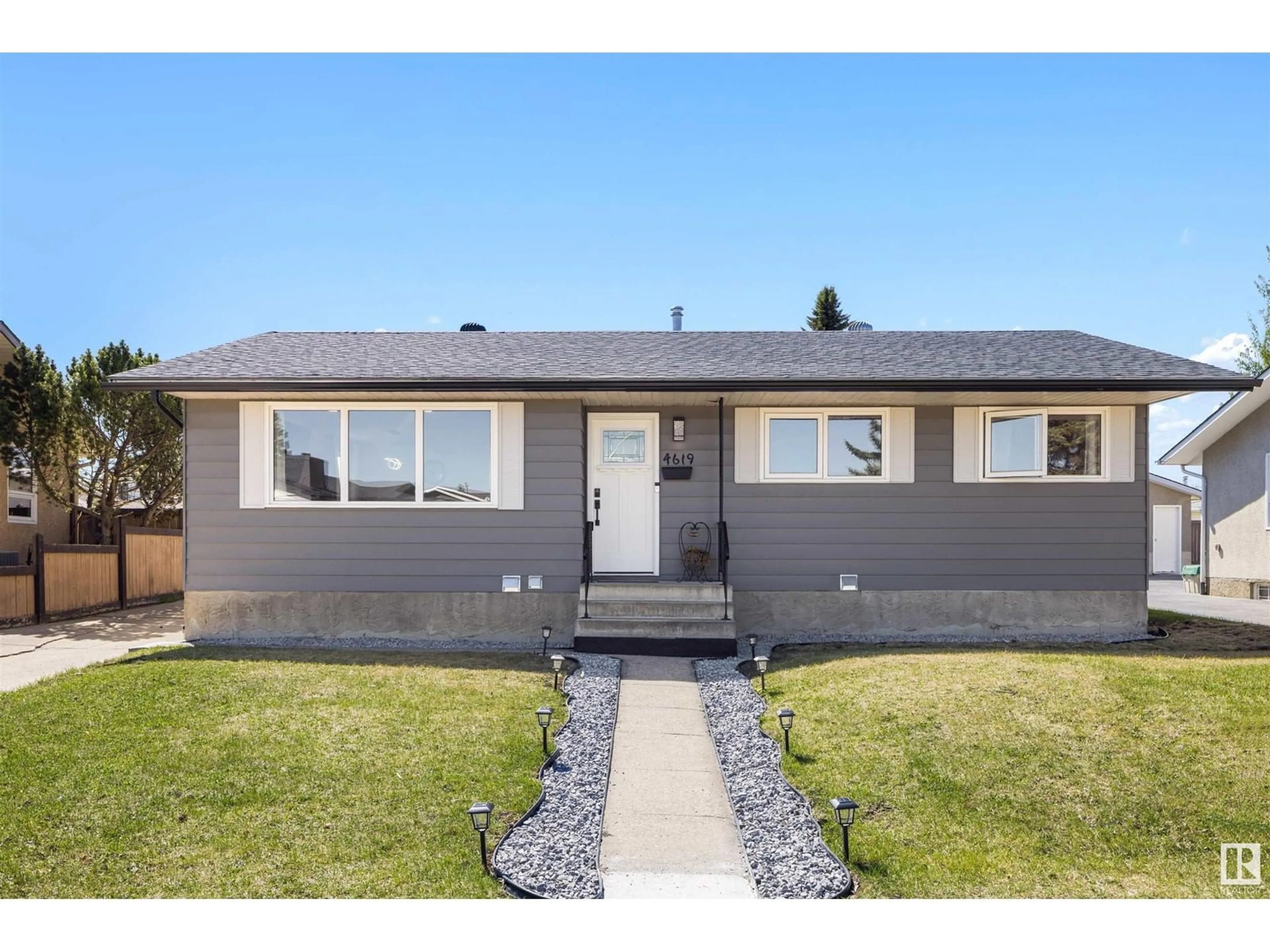 Home with vinyl exterior material, street for 4619 128 AV, Edmonton Alberta T5A2M7