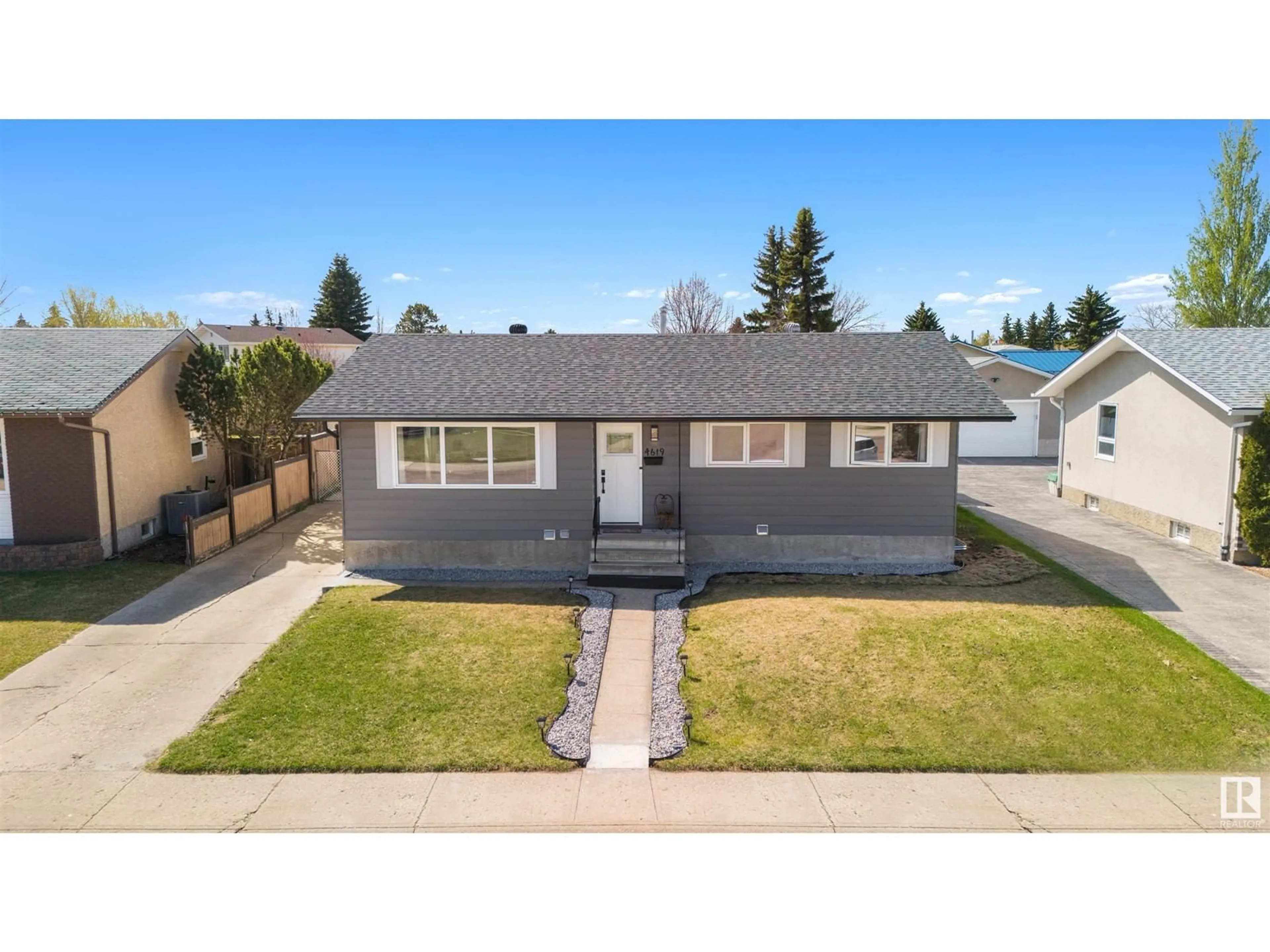 A pic from outside/outdoor area/front of a property/back of a property/a pic from drone, street for 4619 128 AV, Edmonton Alberta T5A2M7