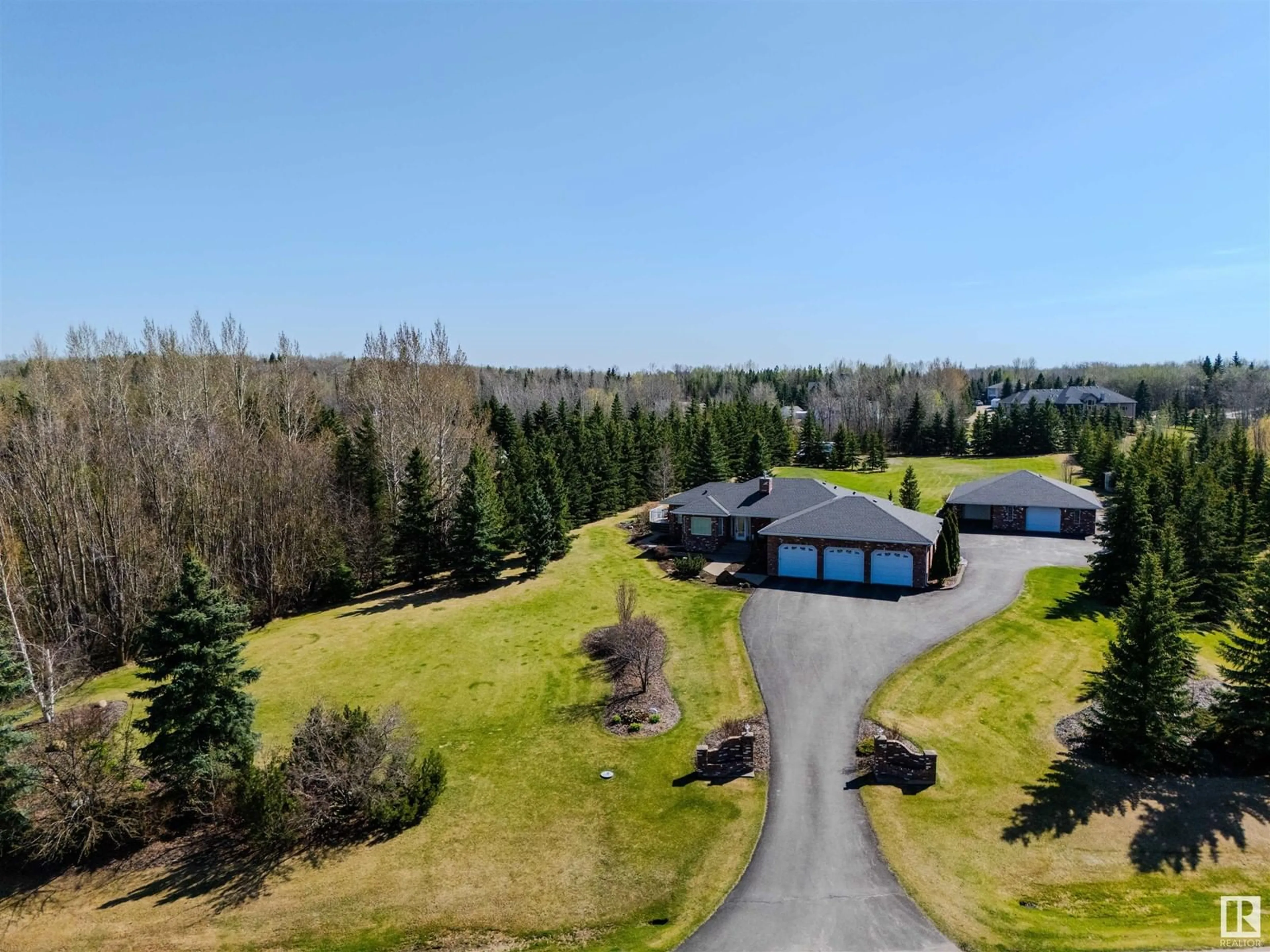 A pic from outside/outdoor area/front of a property/back of a property/a pic from drone, unknown for 313 52258 RGE ROAD 231, Rural Strathcona County Alberta T8B1M7