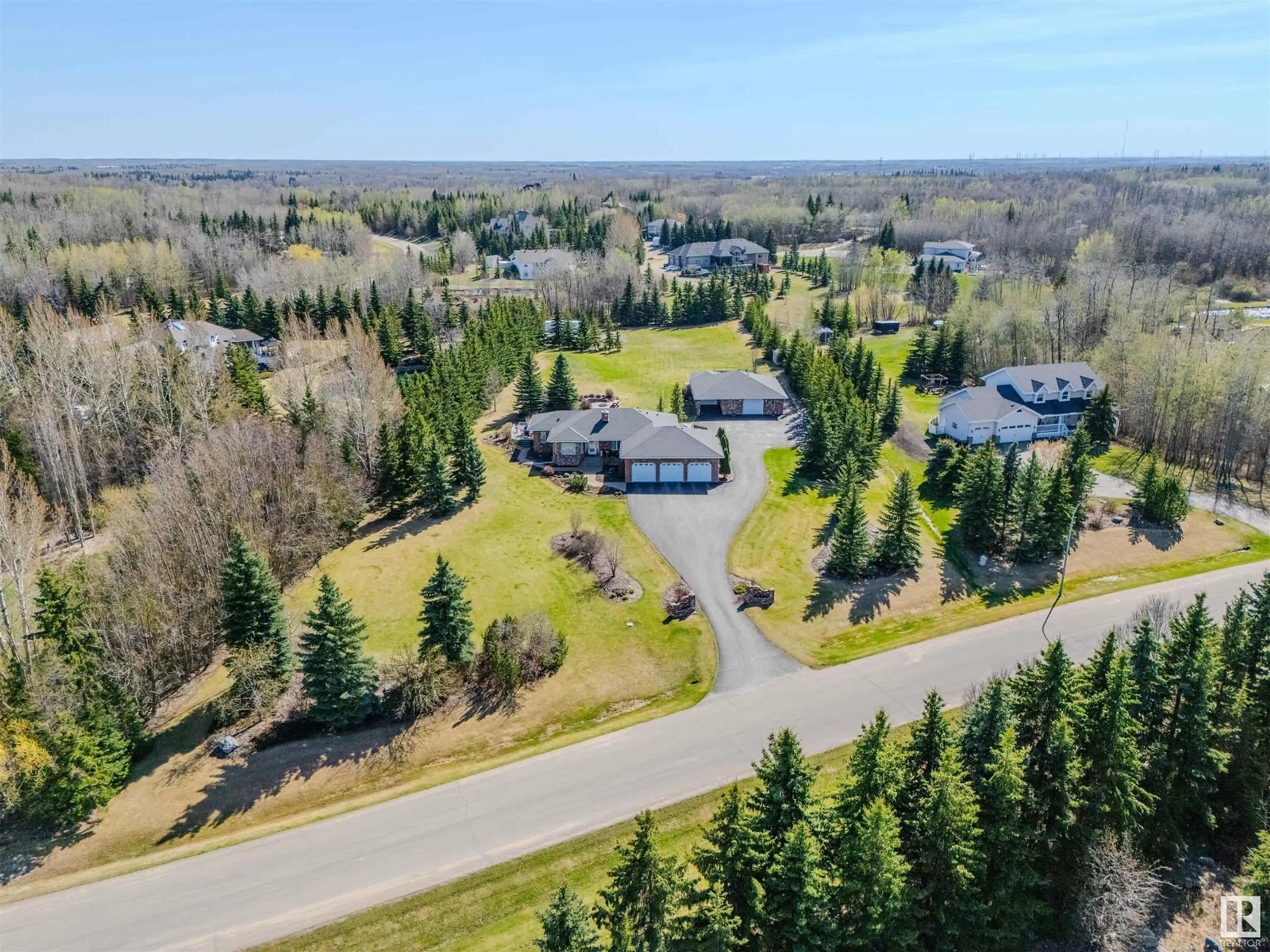 A pic from outside/outdoor area/front of a property/back of a property/a pic from drone, mountain view for 313 52258 RGE ROAD 231, Rural Strathcona County Alberta T8B1M7