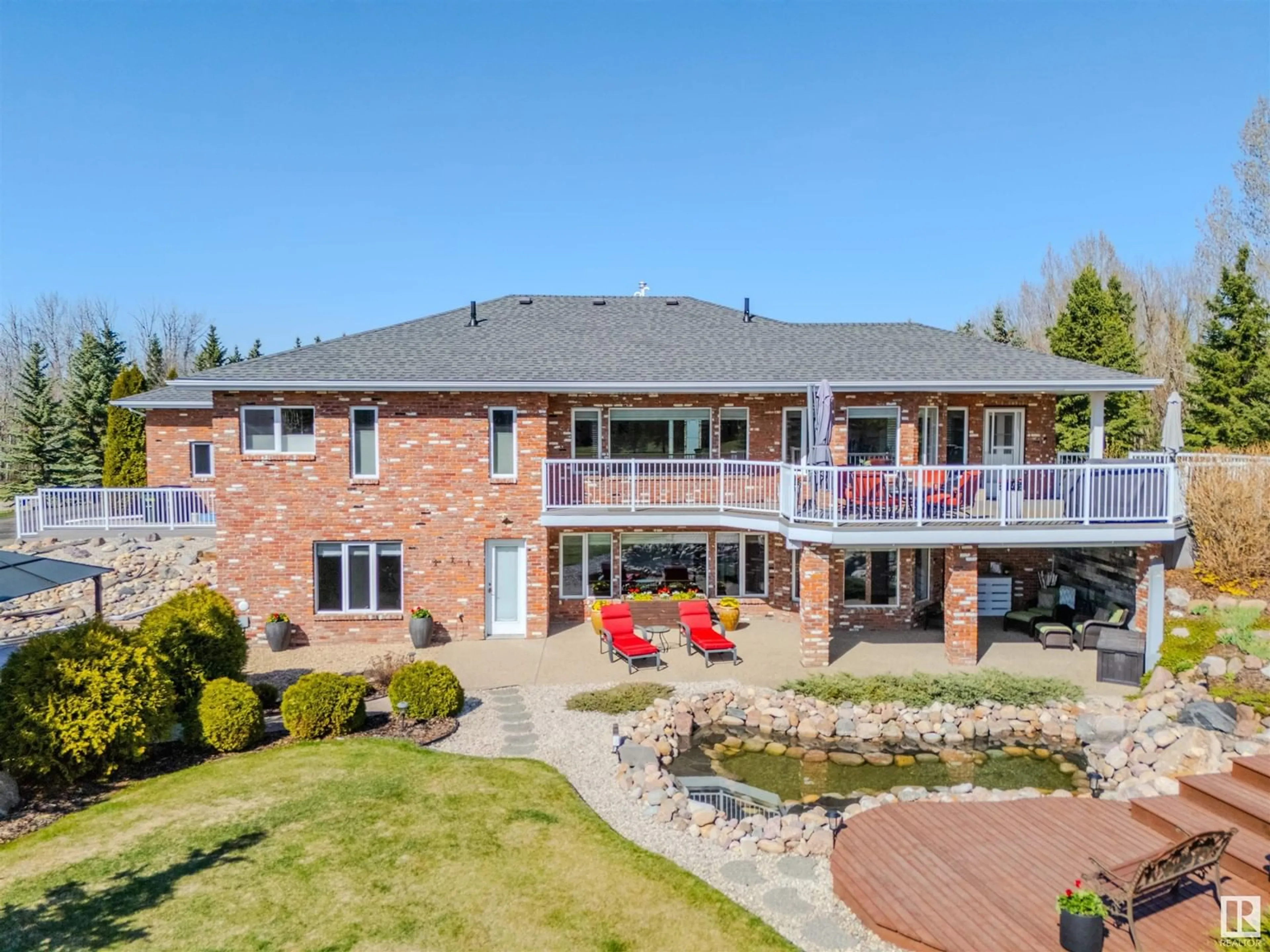 A pic from outside/outdoor area/front of a property/back of a property/a pic from drone, unknown for 313 52258 RGE ROAD 231, Rural Strathcona County Alberta T8B1M7
