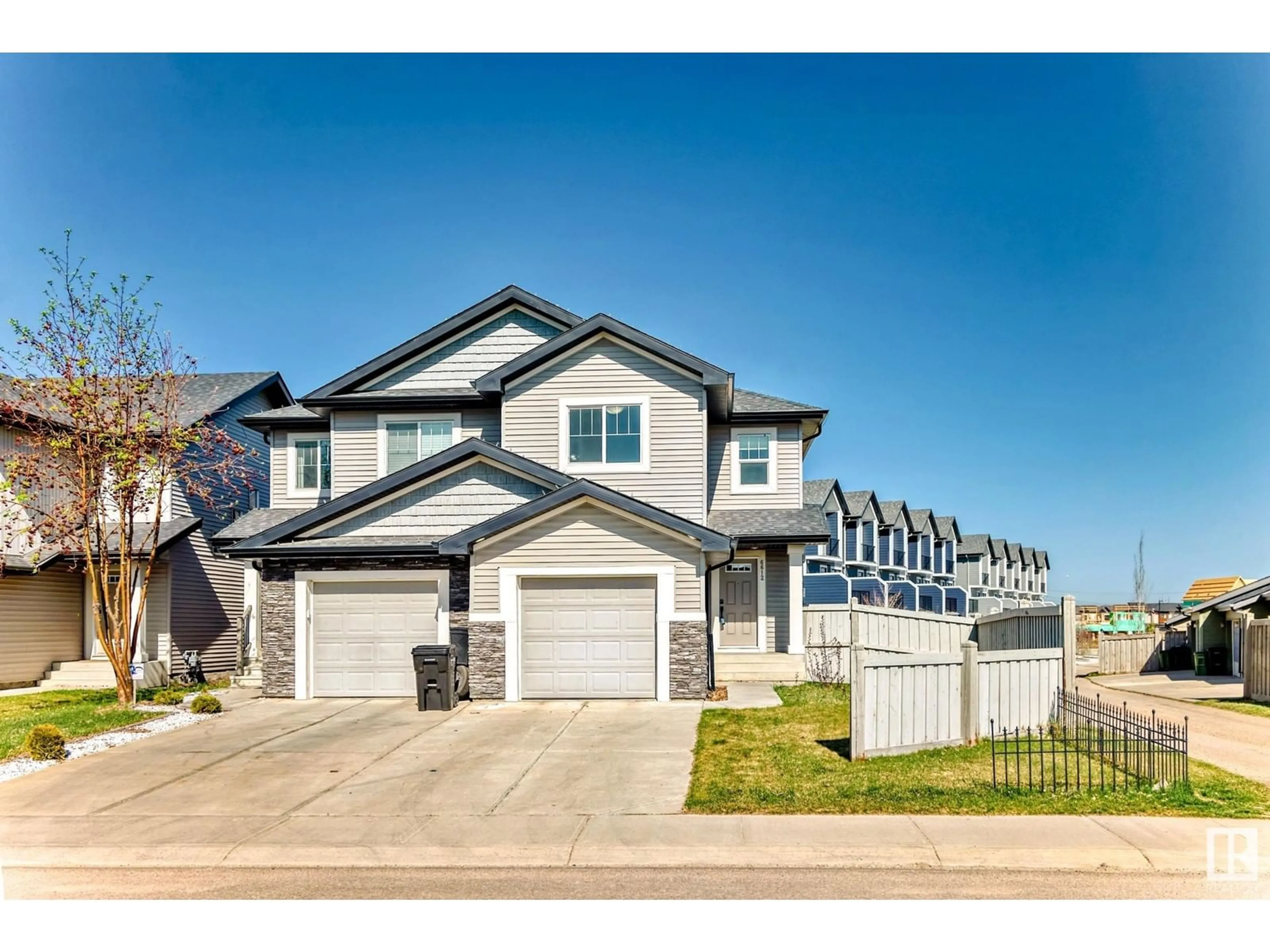 Home with vinyl exterior material, street for 6612 CARDINAL RD SW, Edmonton Alberta T6W1Y9
