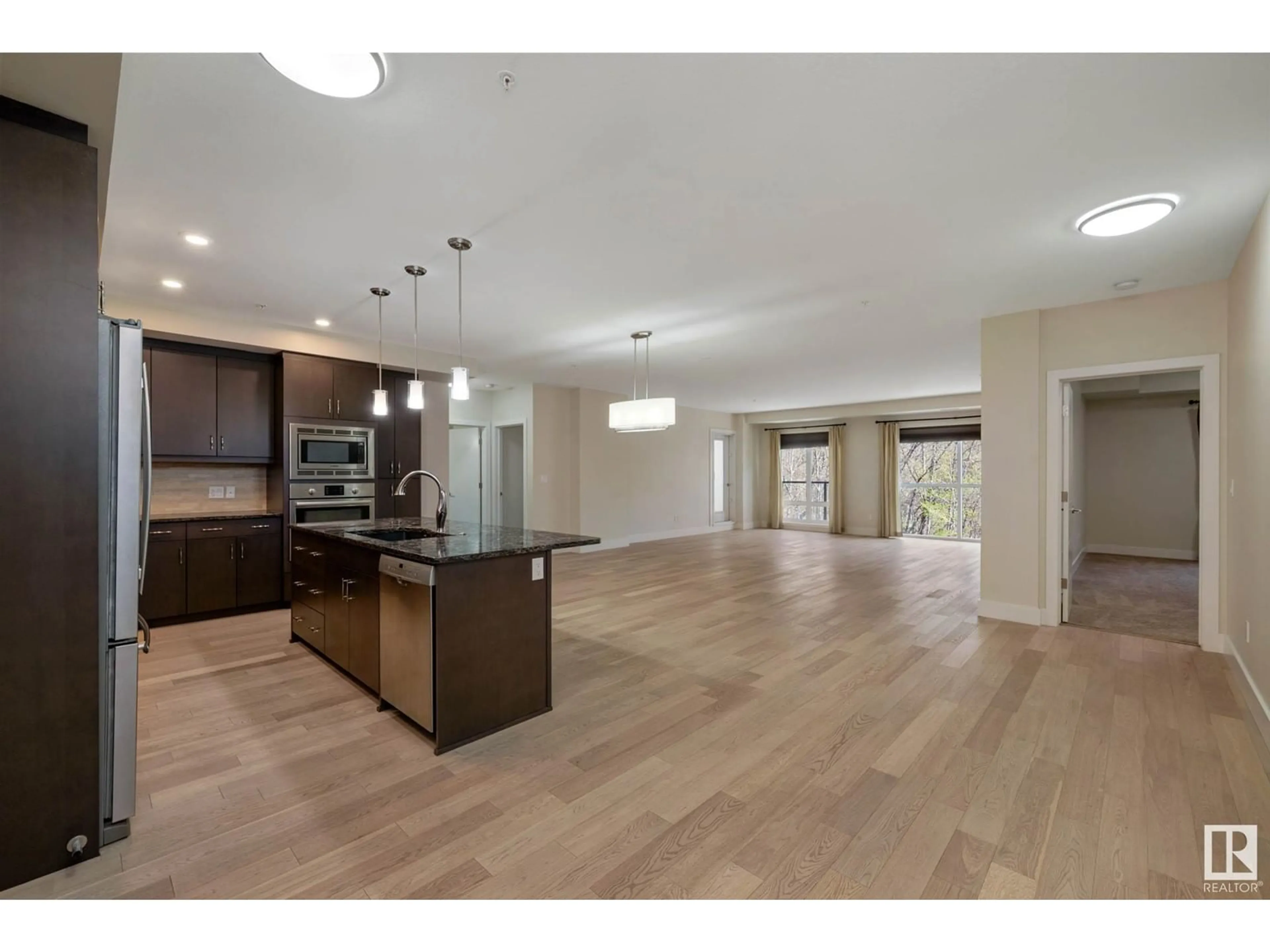 Open concept kitchen, wood/laminate floor for 200 - 207 BELLEROSE DR, St. Albert Alberta T8N7P7