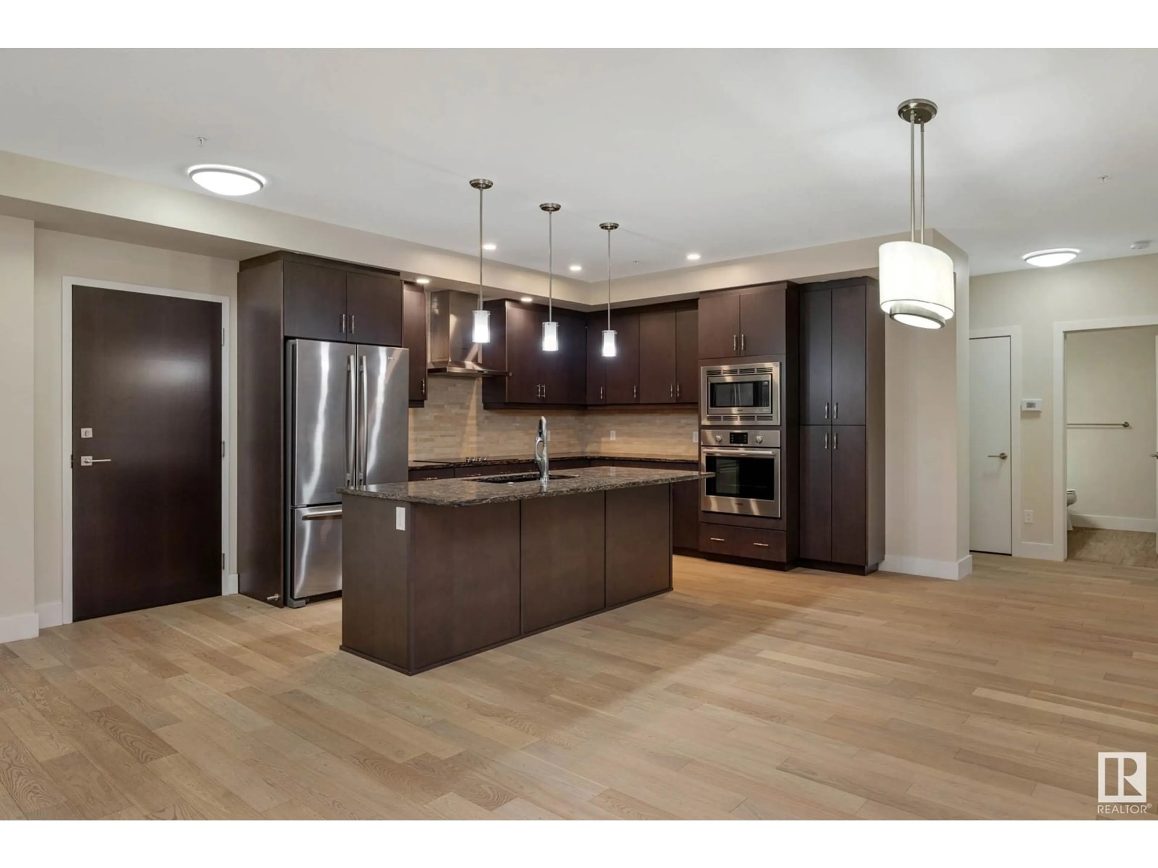 Open concept kitchen, wood/laminate floor for 200 - 207 BELLEROSE DR, St. Albert Alberta T8N7P7