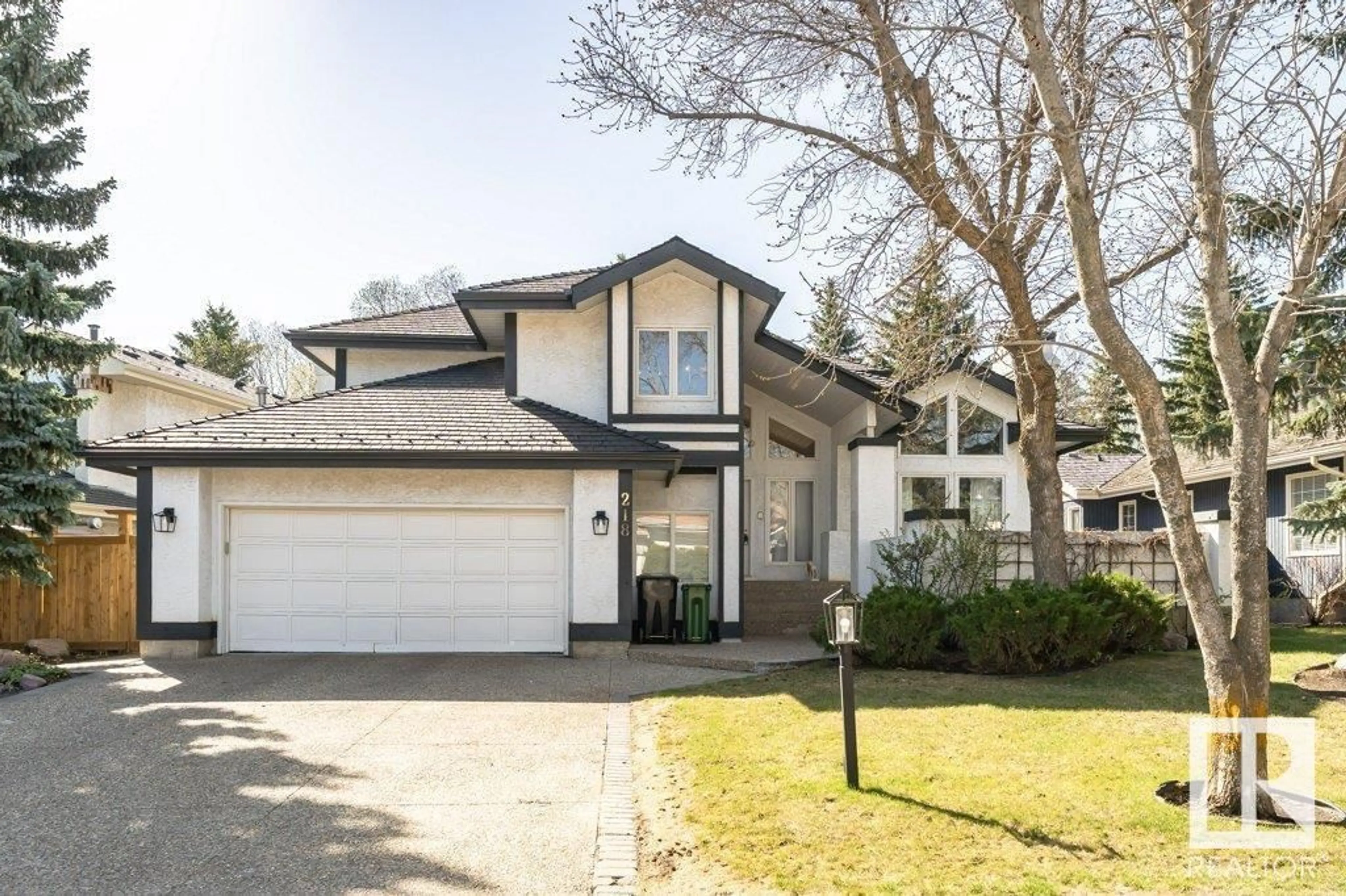 Home with vinyl exterior material, street for 218 OMAND DR, Edmonton Alberta T6R1L7
