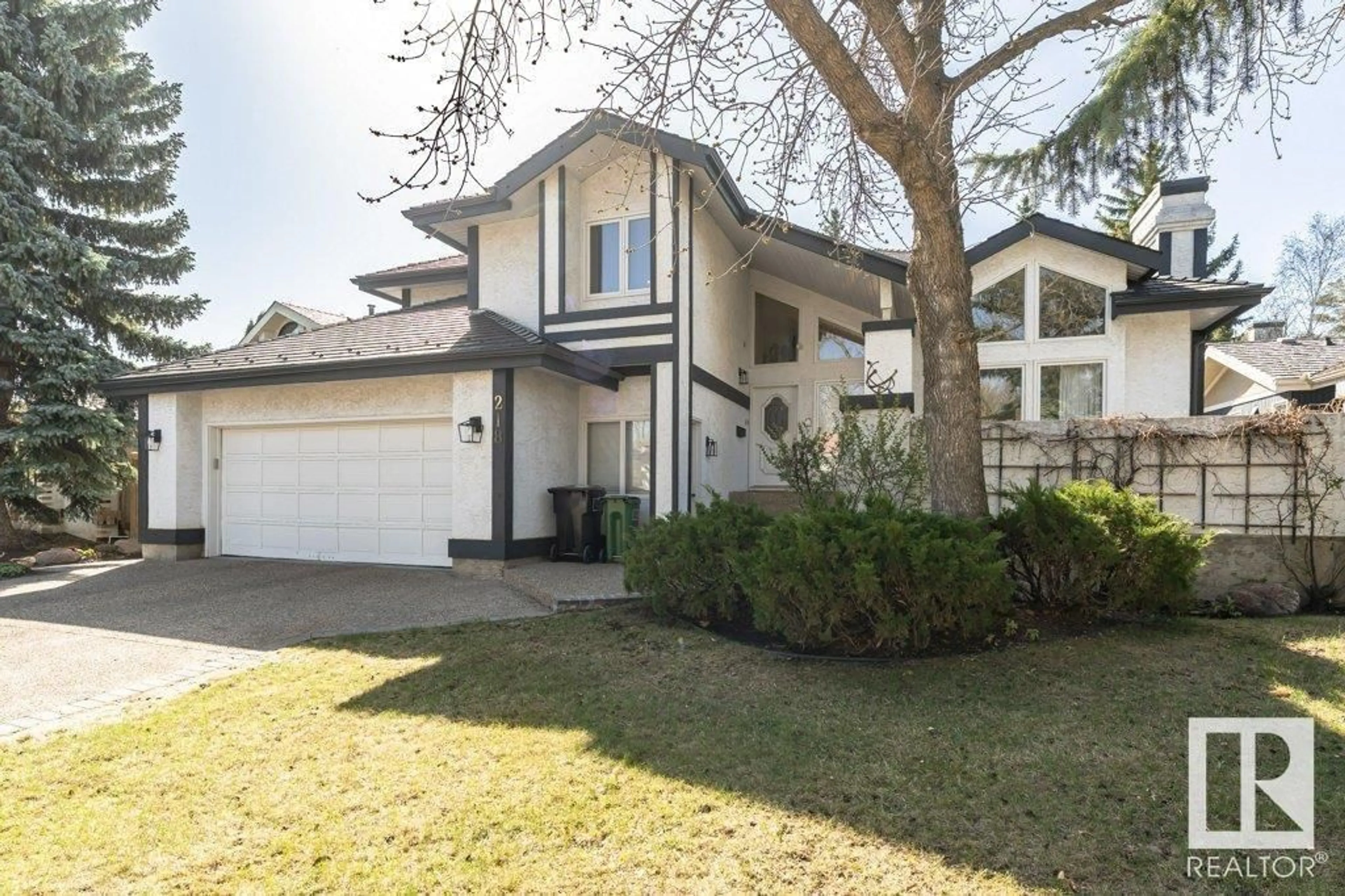 Home with vinyl exterior material, street for 218 OMAND DR, Edmonton Alberta T6R1L7