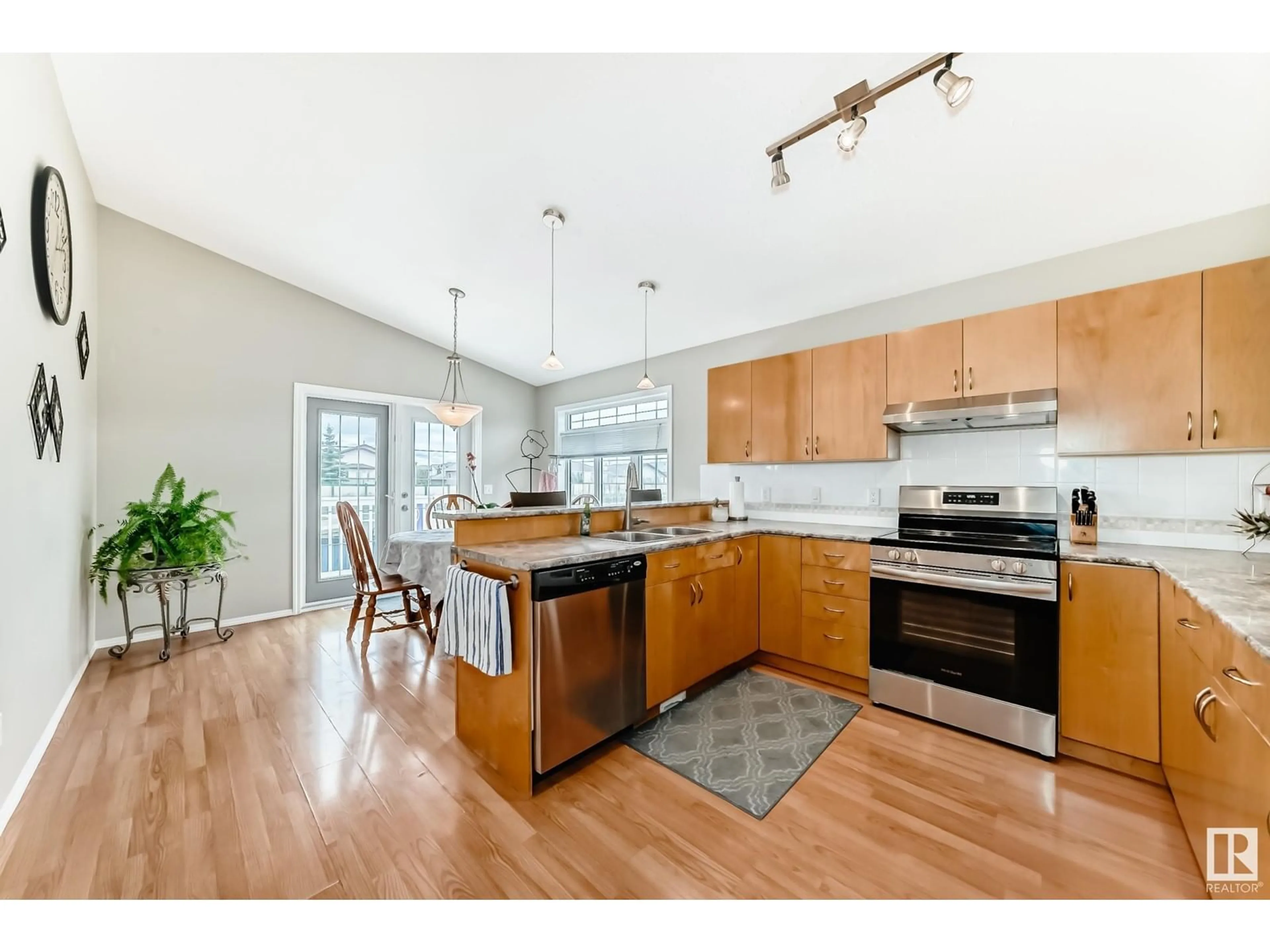 Open concept kitchen, wood/laminate floor for NW - 16203 83 ST, Edmonton Alberta T5Z3L5