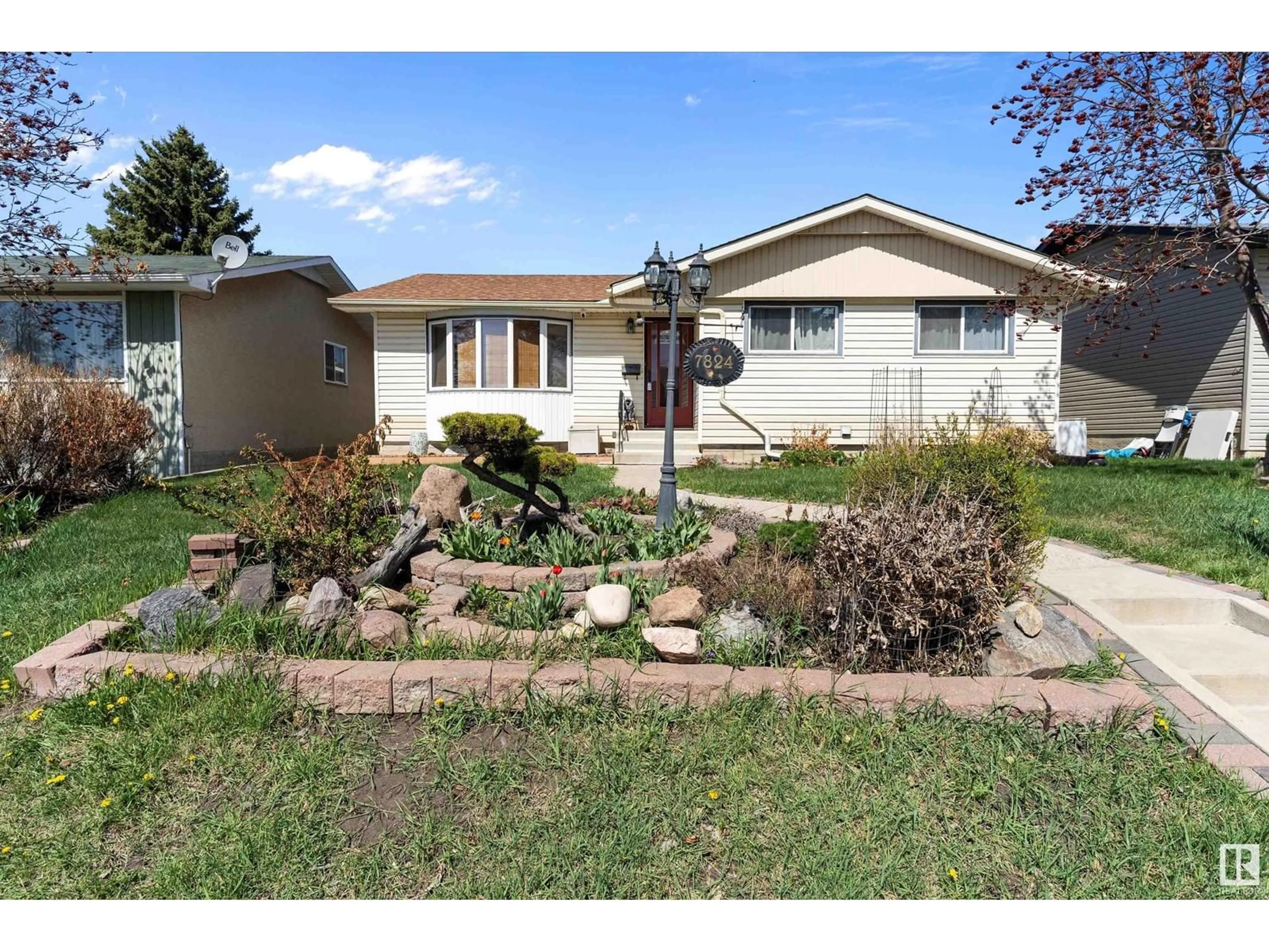 Home with vinyl exterior material, street for 7824 147 AV, Edmonton Alberta T5C2T4