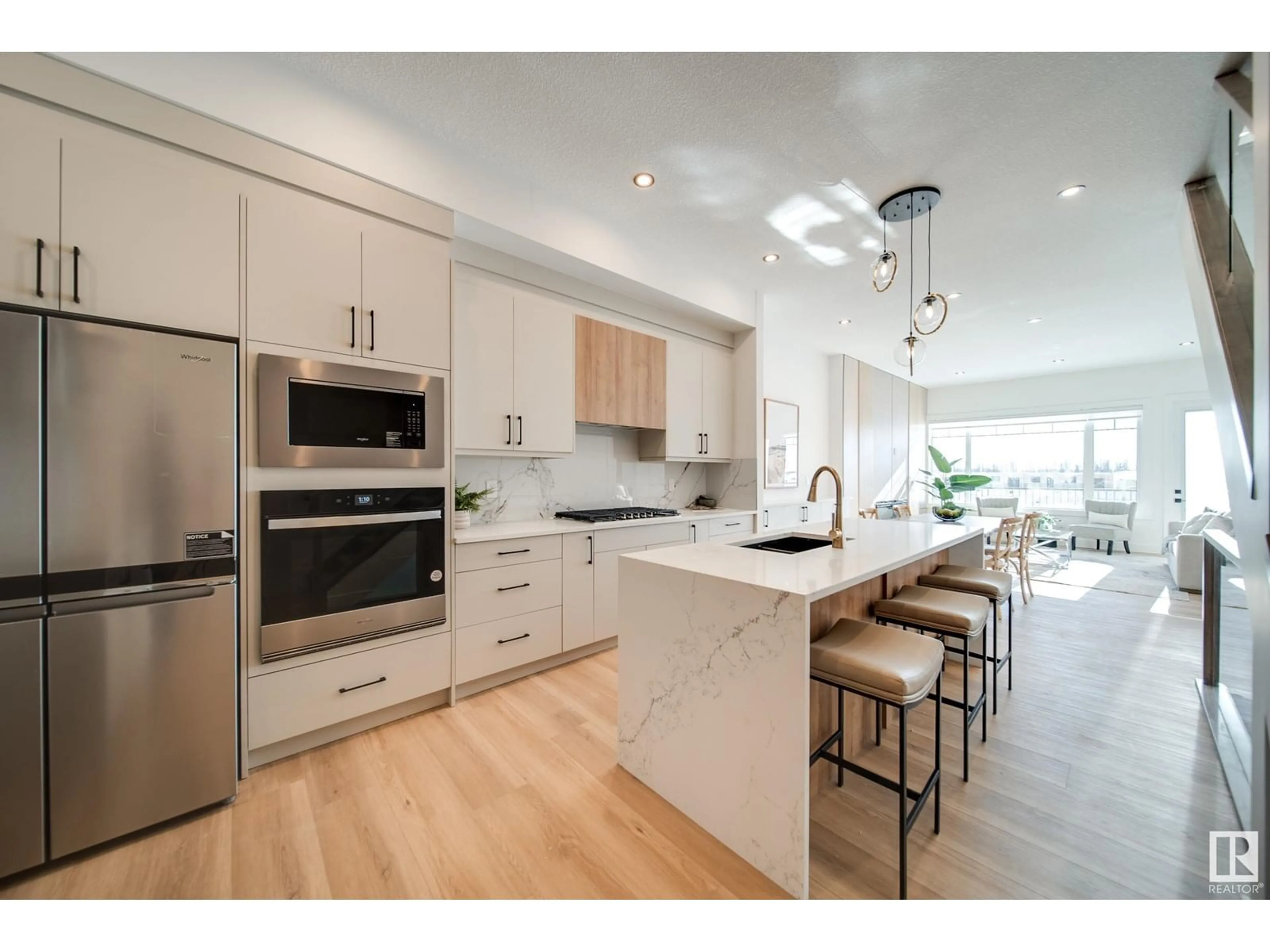 Open concept kitchen, wood/laminate floor for 17 STARLING, Fort Saskatchewan Alberta T8L1R5