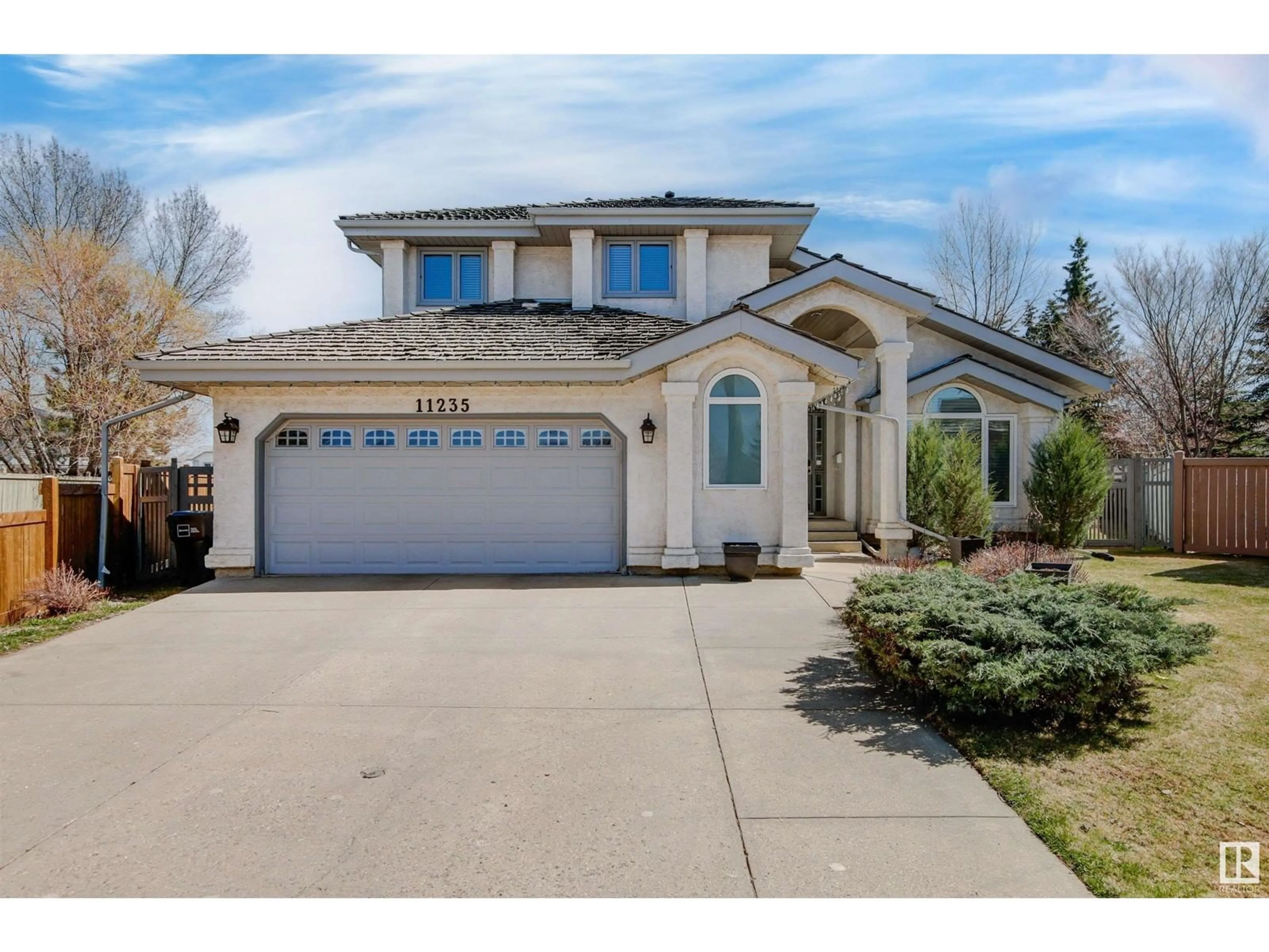 Home with vinyl exterior material, street for 11235 10A AV, Edmonton Alberta T6J6S3