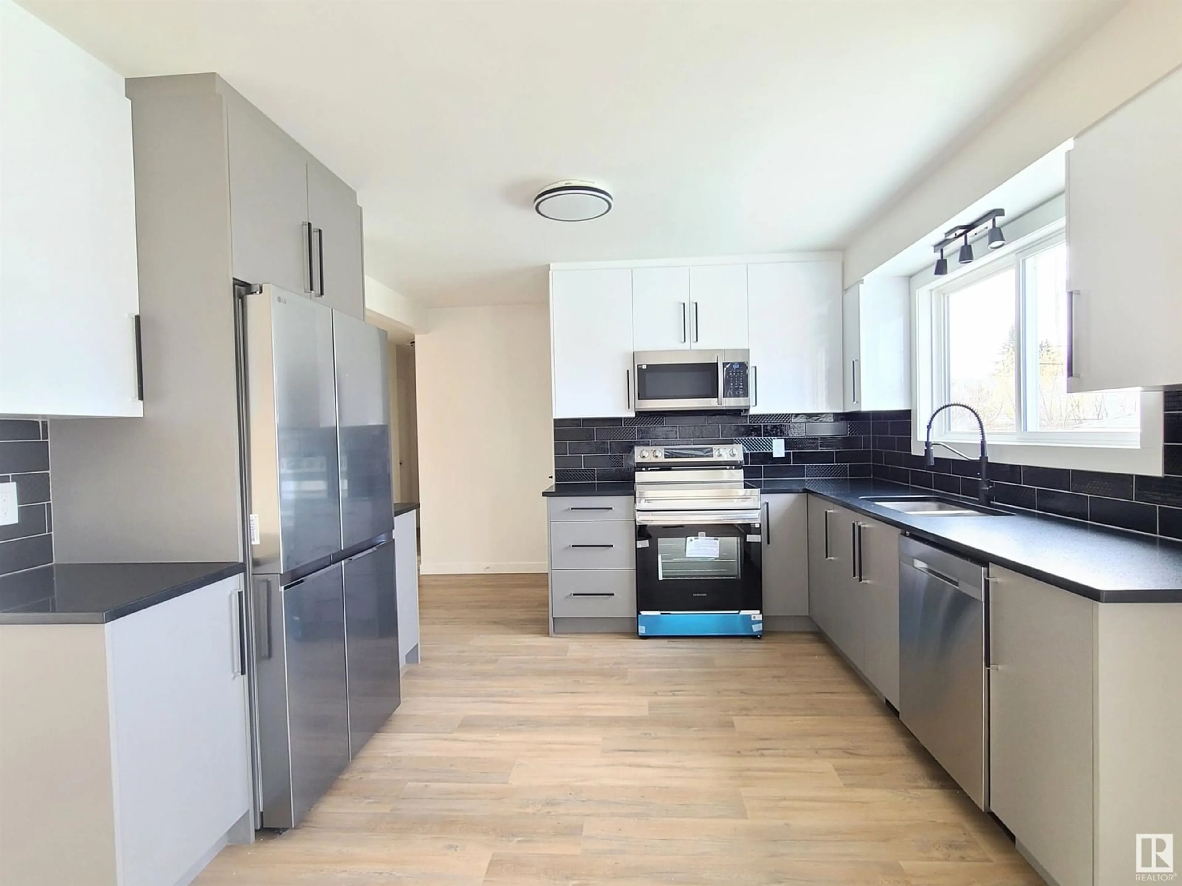Open concept kitchen, unknown for NW - 12904 93 ST, Edmonton Alberta T5E3T2