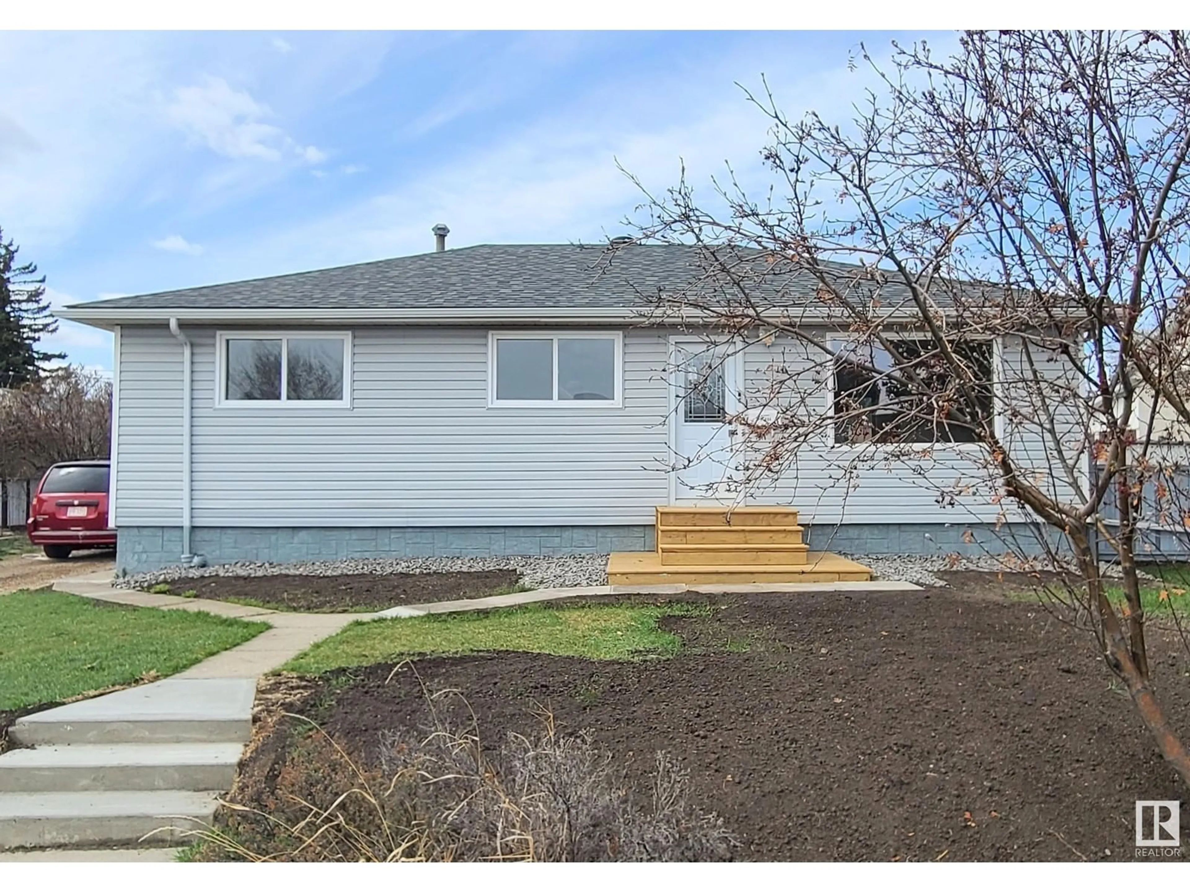 Home with vinyl exterior material, street for NW - 12904 93 ST, Edmonton Alberta T5E3T2