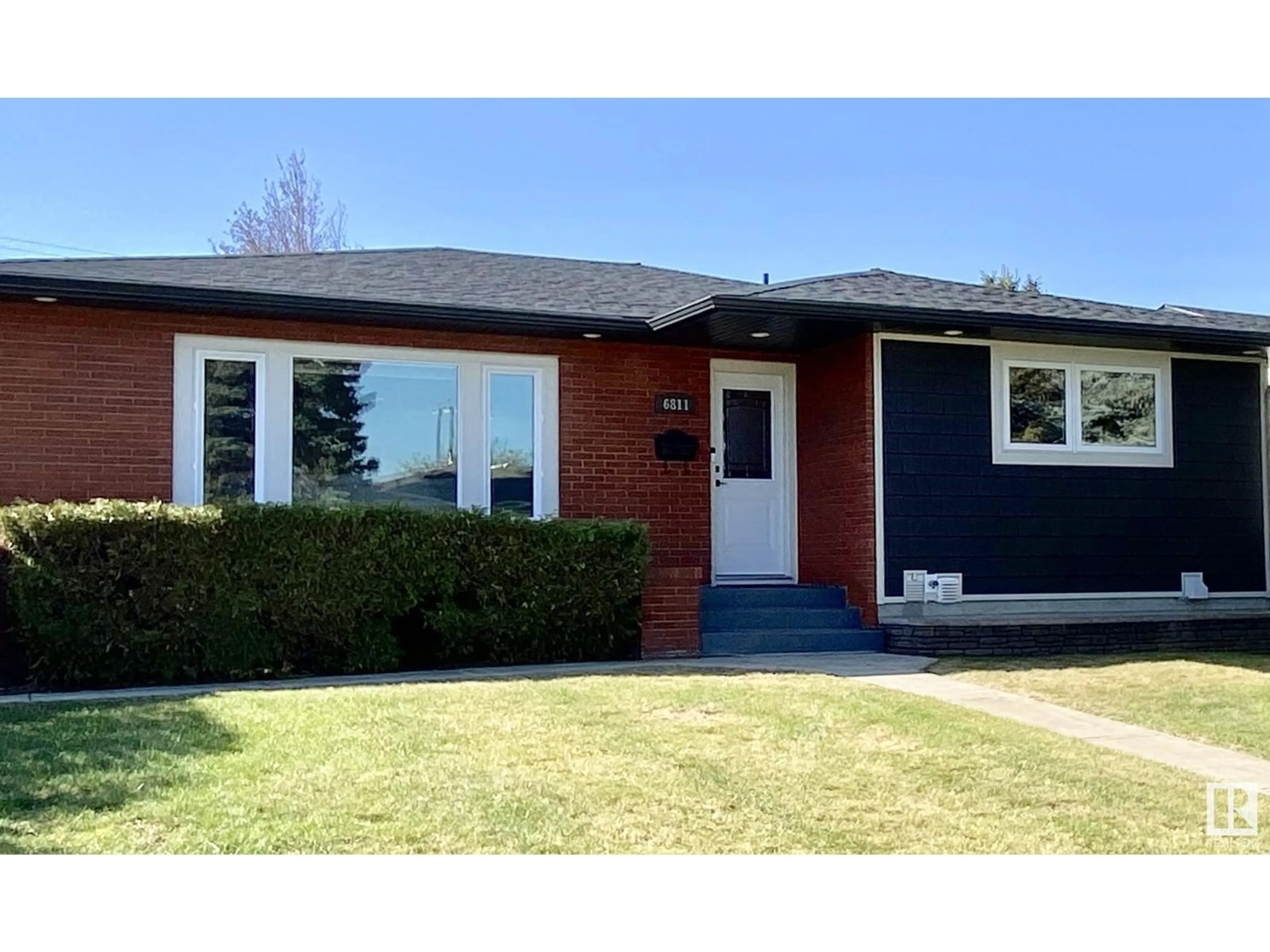 Home with brick exterior material, street for 6811 98A AV, Edmonton Alberta T6A0B9