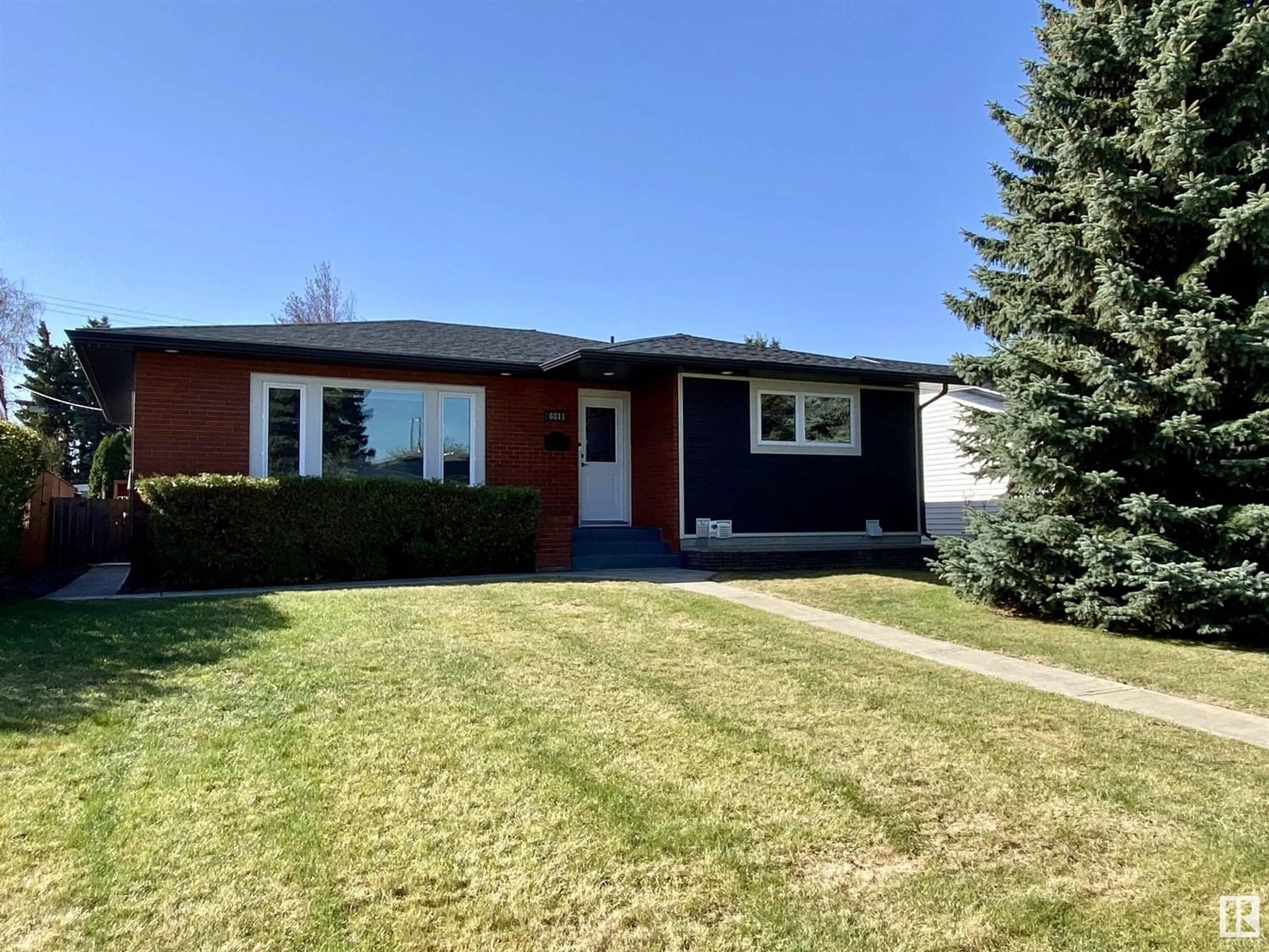 Home with vinyl exterior material, street for 6811 98A AV, Edmonton Alberta T6A0B9